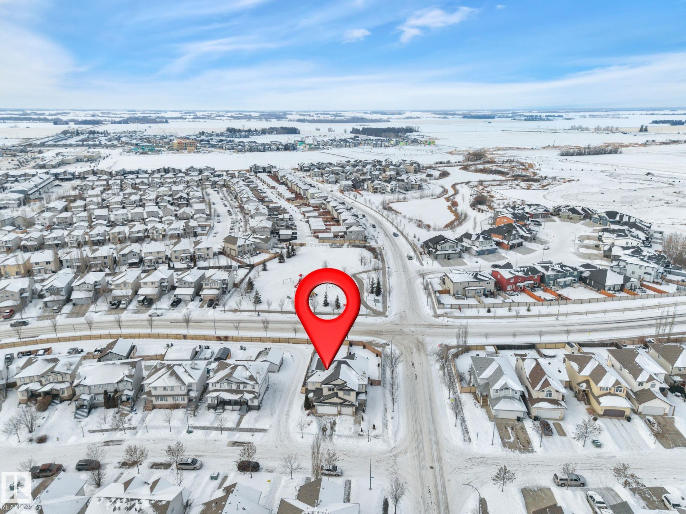 Aerial view of property's location featuring nearby suburban area - 457 Aster Close, Leduc, AB - Outdoor With View