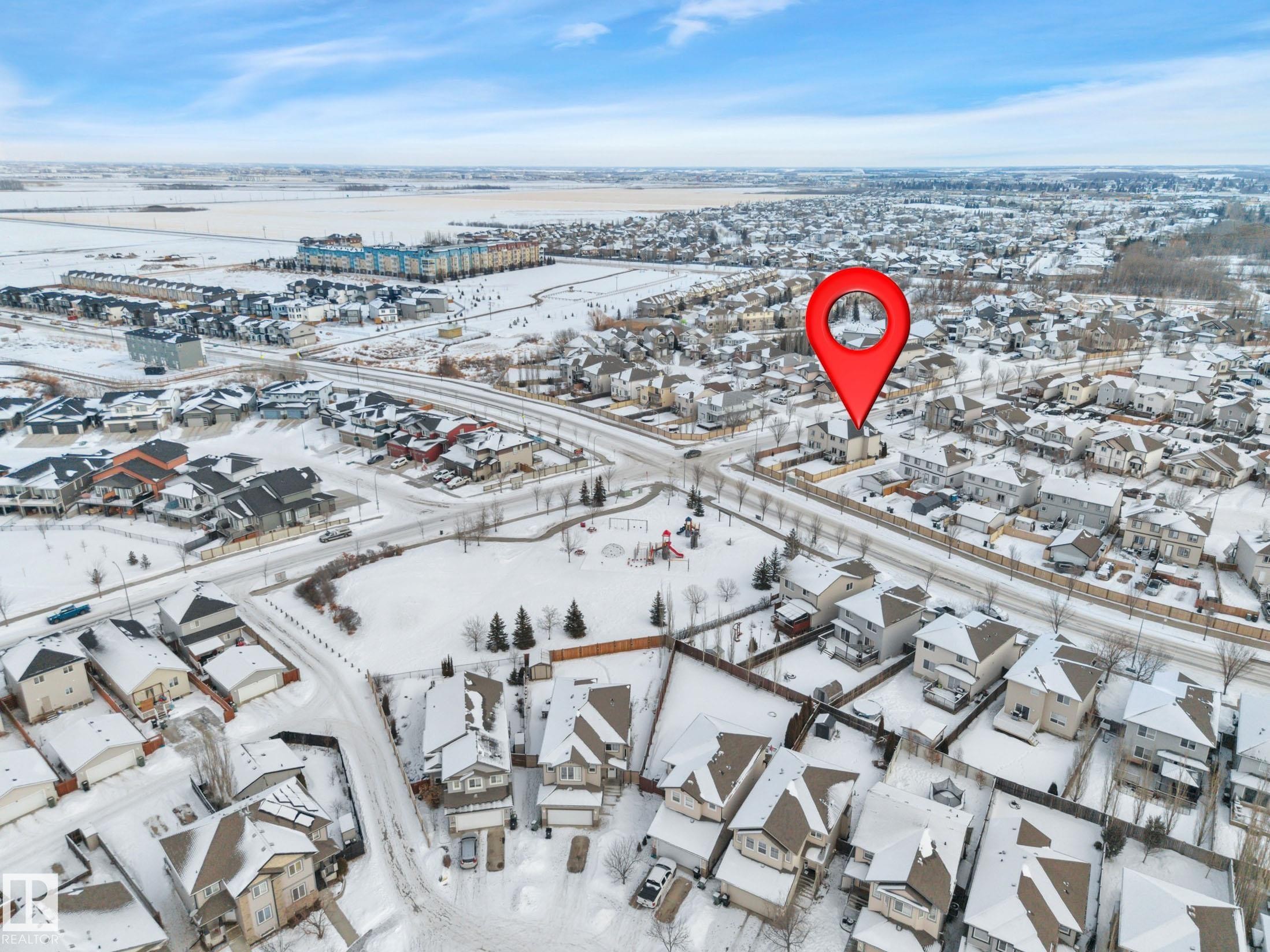 Snowy aerial view featuring a residential view - 457 Aster Close, Leduc, AB - Outdoor With View