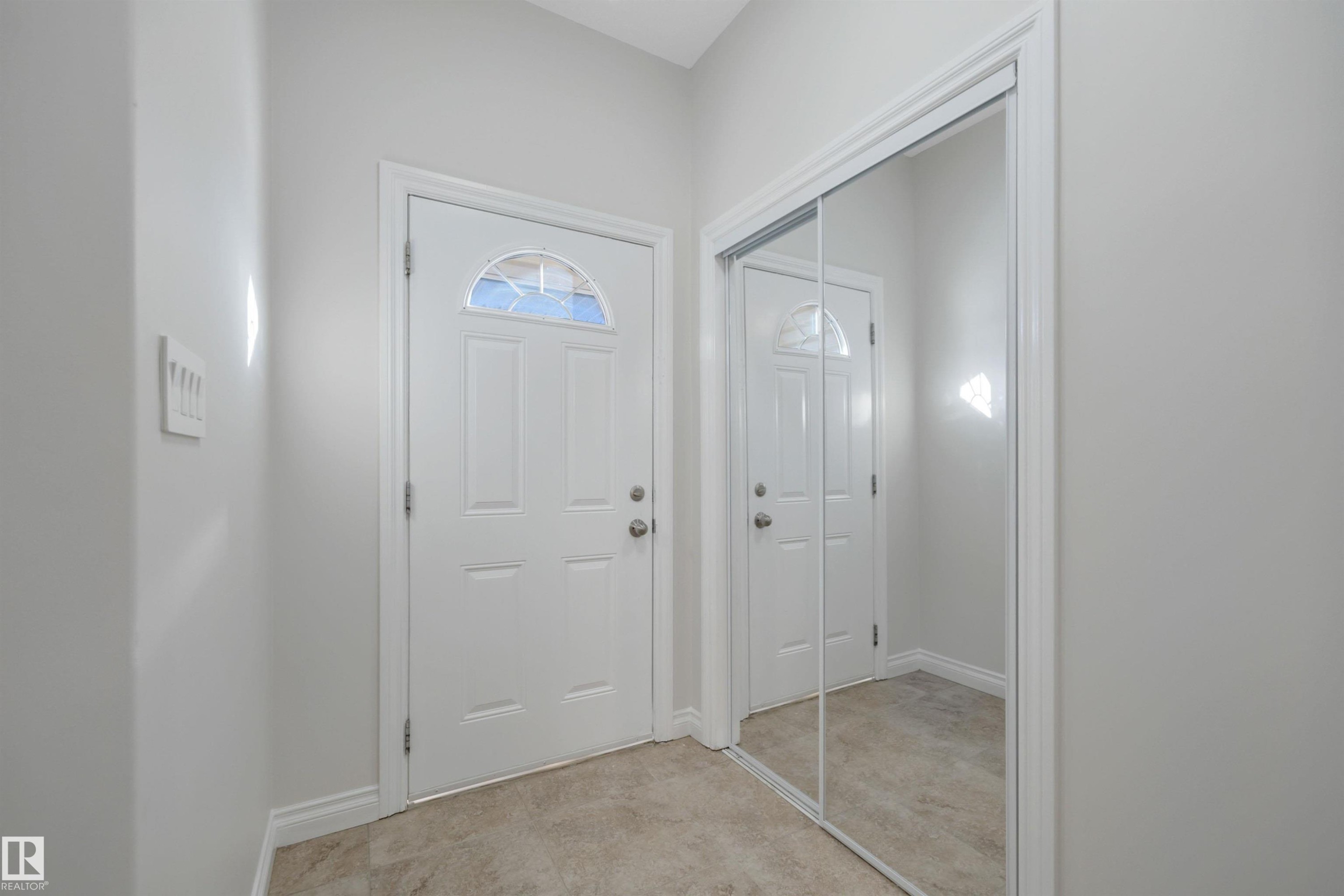 Entrance foyer with baseboards - 457 Aster Close, Leduc, AB - Indoor Photo Showing Other Room