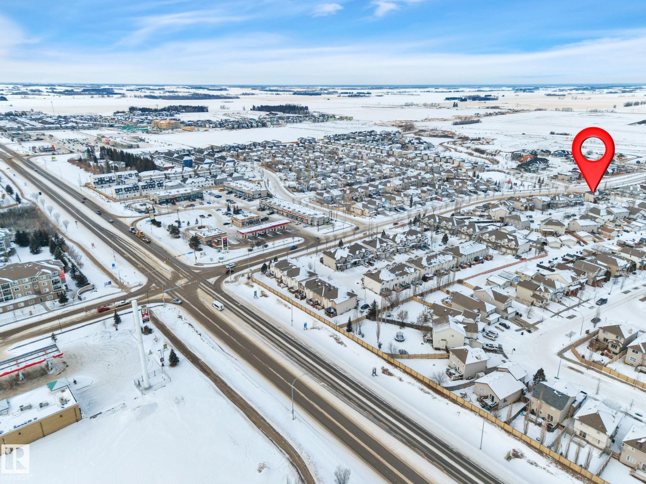 Snowy aerial view with a residential view - 457 Aster Close, Leduc, AB - Outdoor With View