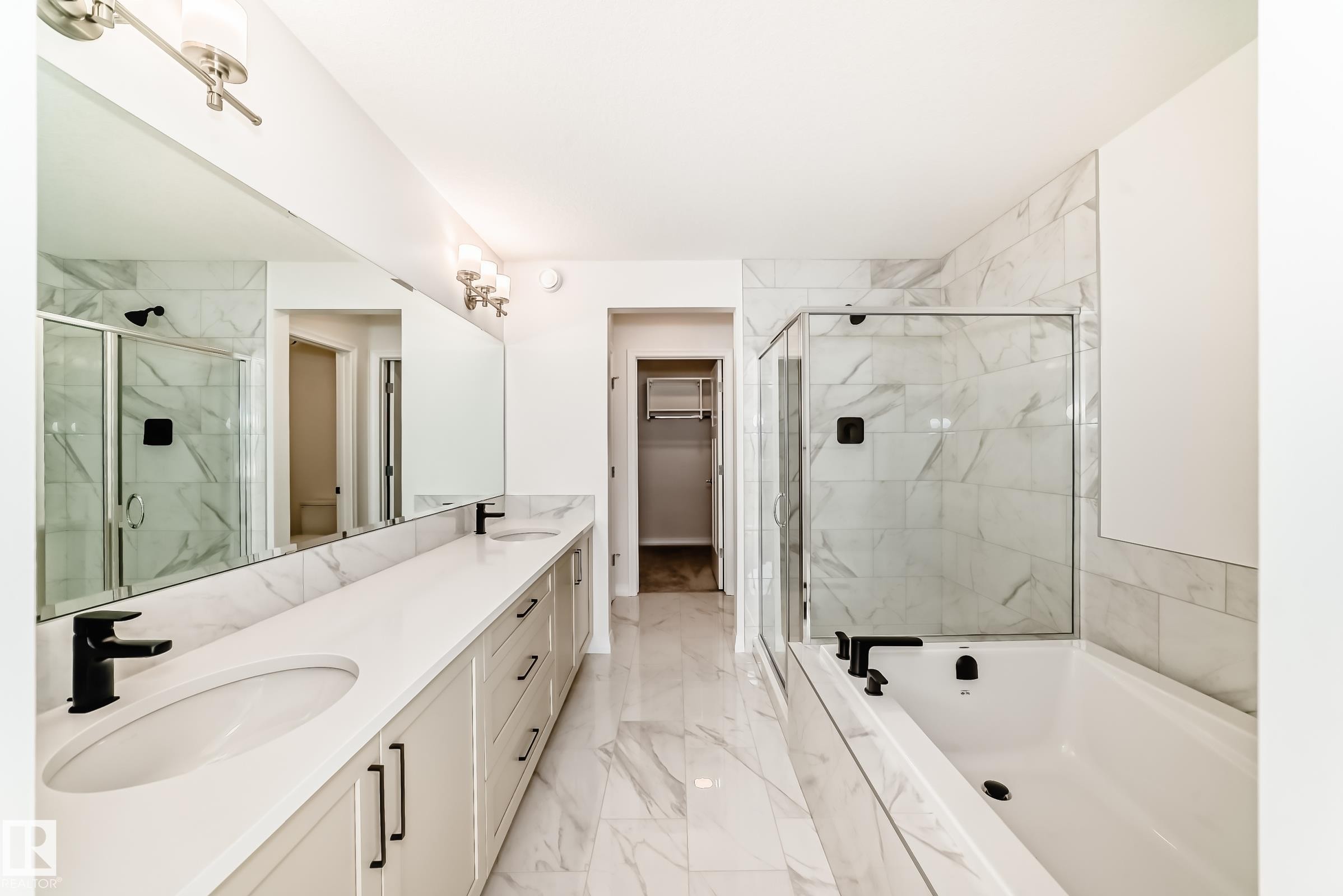 Bathroom with a walk in closet, a marble finish shower, double vanity, light marble finish floors, and a bath - 3249 Dixon Way, Edmonton, AB - Indoor Photo Showing Bathroom