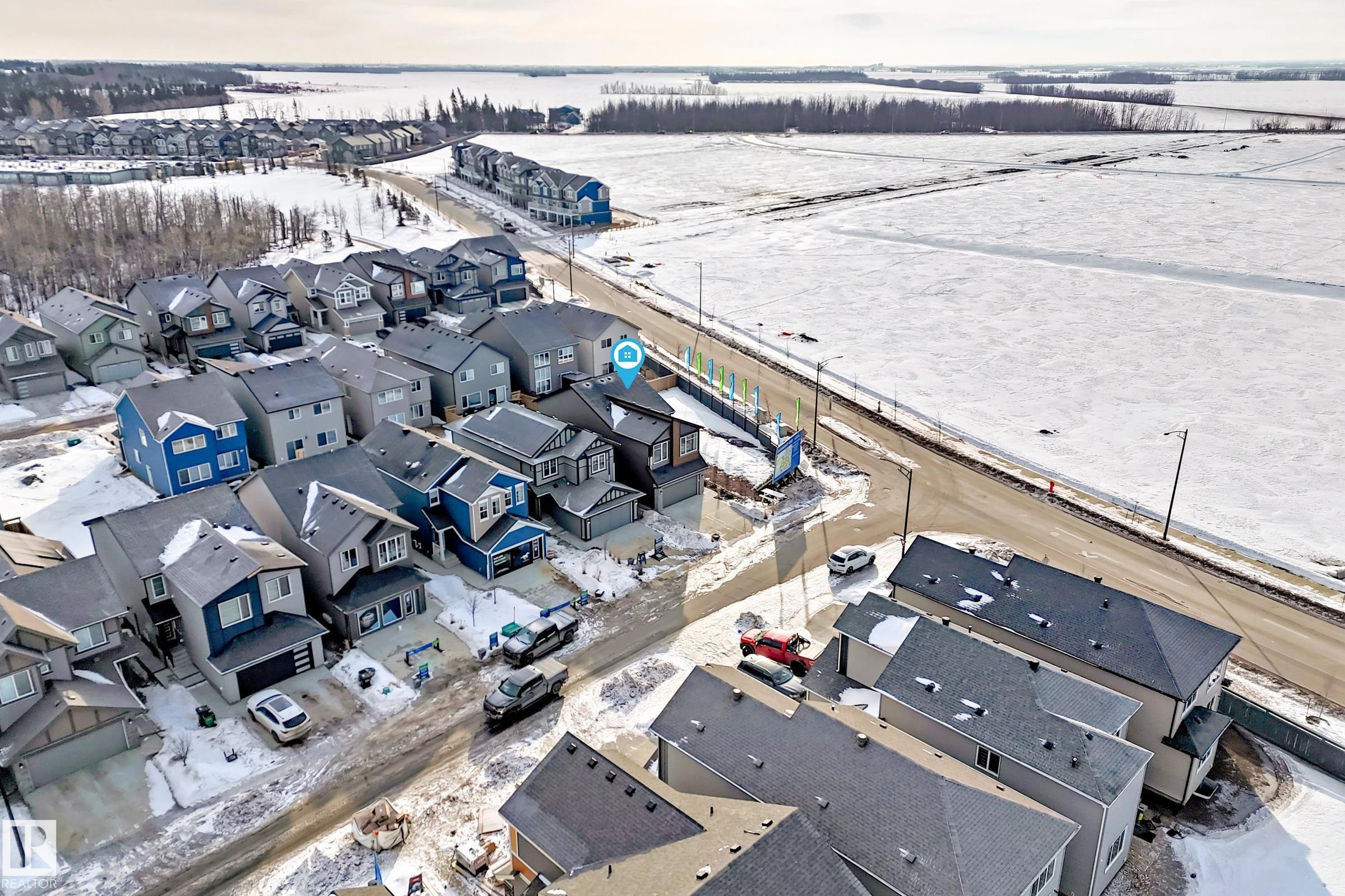 Snowy aerial view with a residential view - 3249 Dixon Way, Edmonton, AB - Outdoor With View