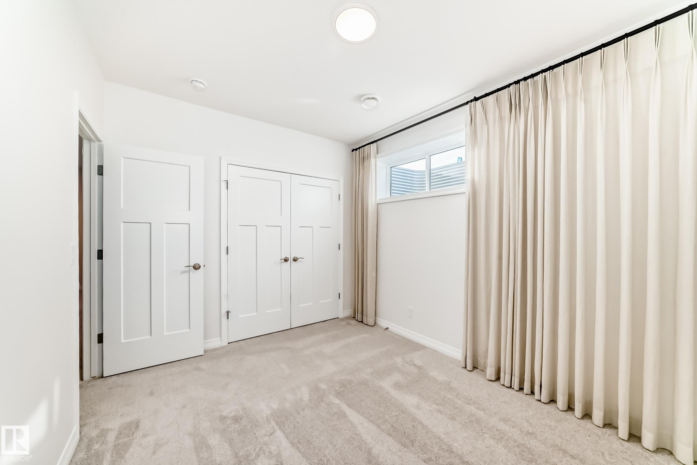 Unfurnished bedroom with carpet flooring and a closet - 3249 Dixon Way, Edmonton, AB - Indoor Photo Showing Other Room