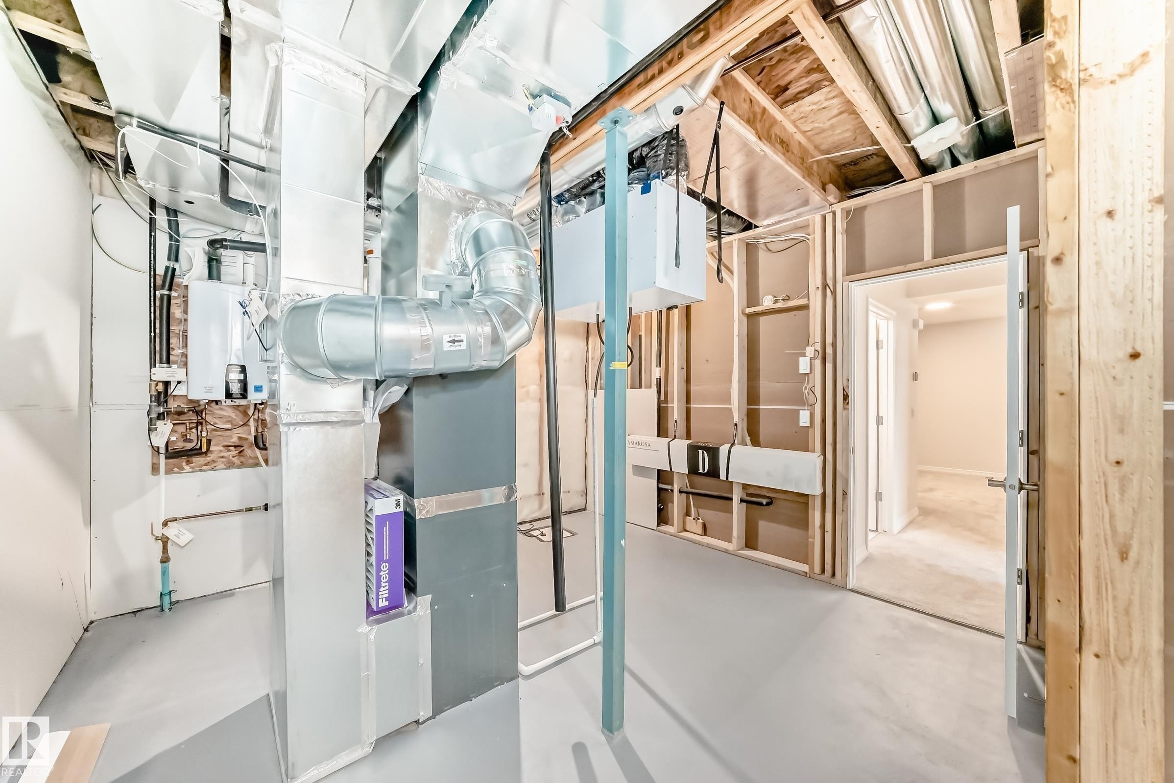Utility room featuring heating unit and water heater - 3249 Dixon Way, Edmonton, AB - Indoor