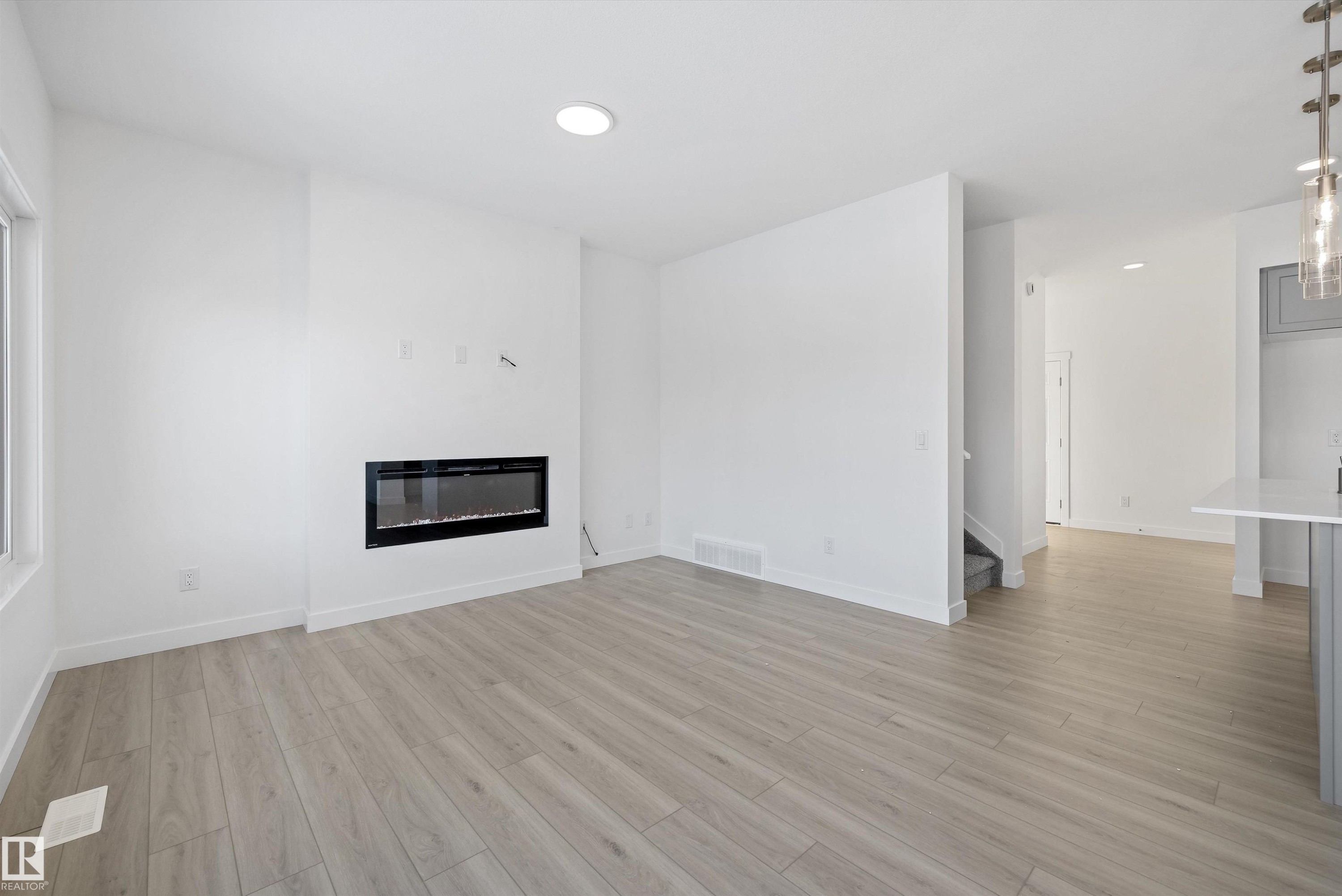 4182 Kinglet Drive, Edmonton, AB - Indoor Photo Showing Living Room With Fireplace