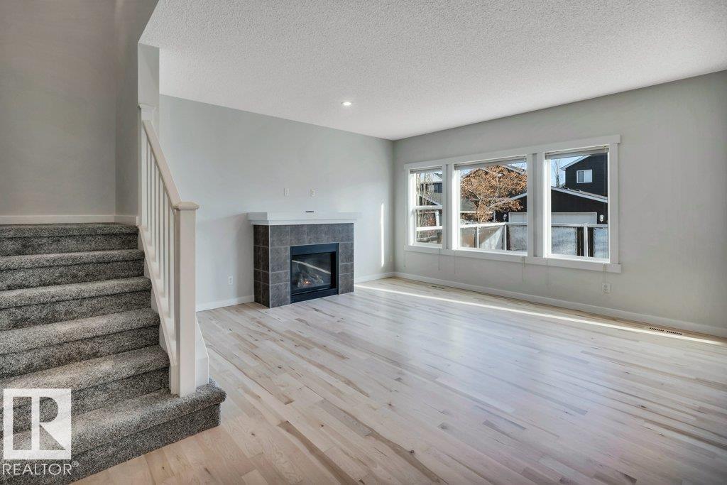 237 Sheppard Circle, Leduc, AB - Indoor Photo Showing Living Room With Fireplace