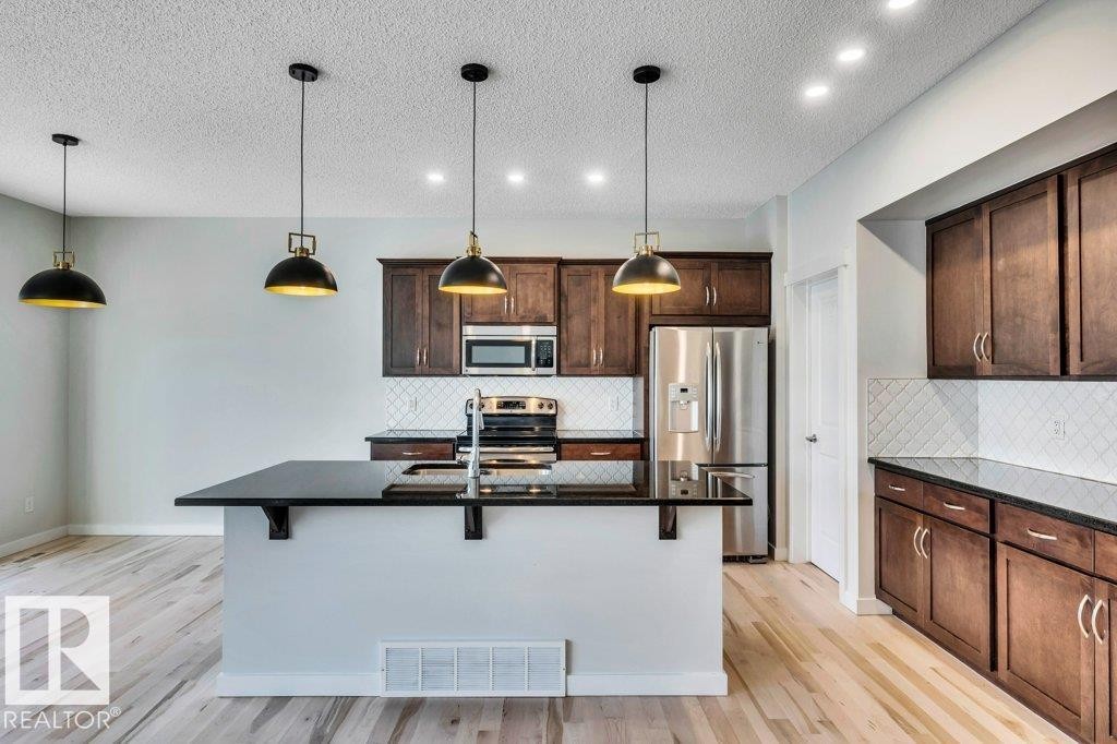 237 Sheppard Circle, Leduc, AB - Indoor Photo Showing Kitchen With Double Sink With Upgraded Kitchen