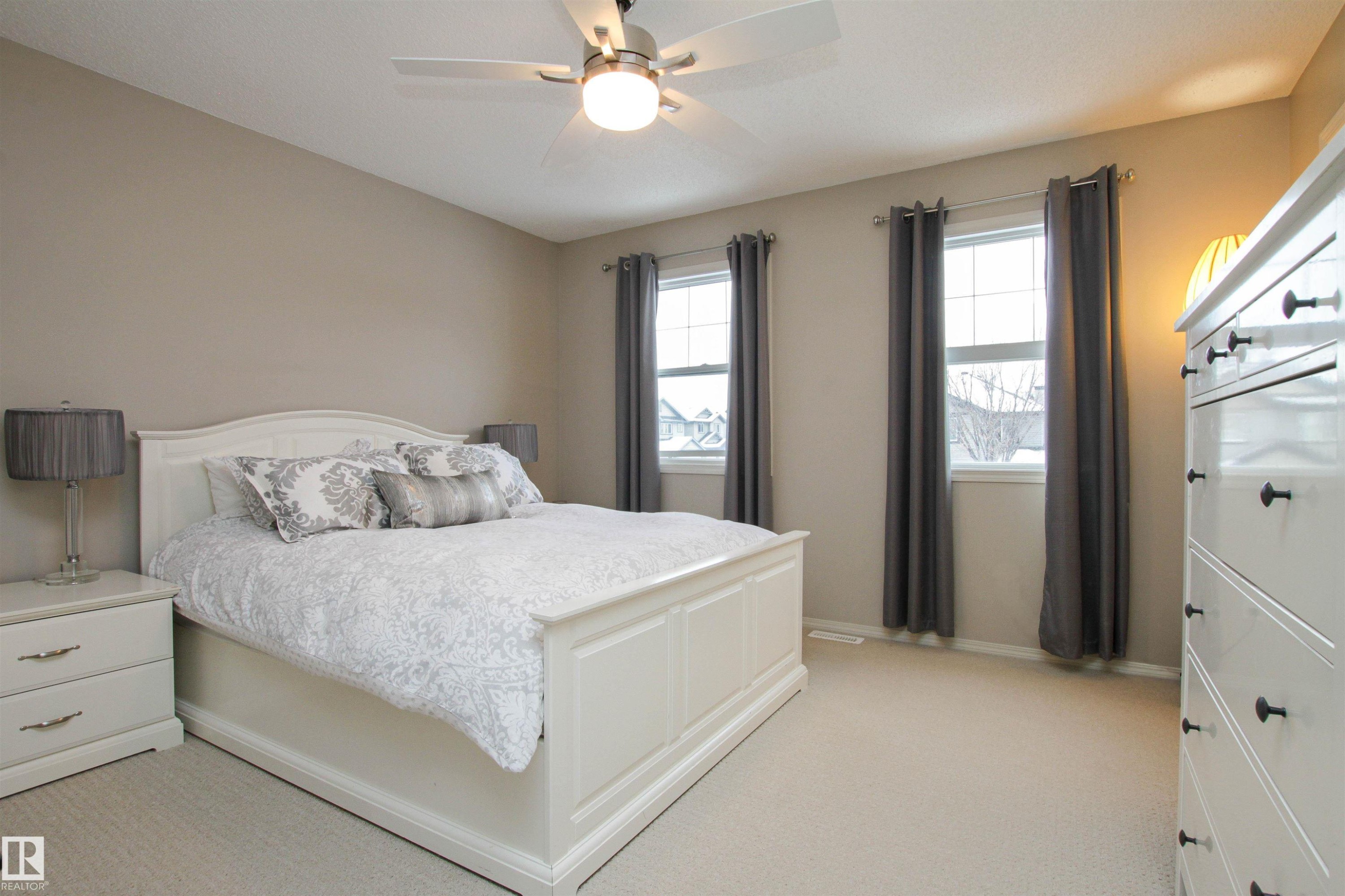 Bedroom with light colored carpet and ceiling fan - 2315 Lemieux Place, Edmonton, AB - Indoor Photo Showing Bedroom