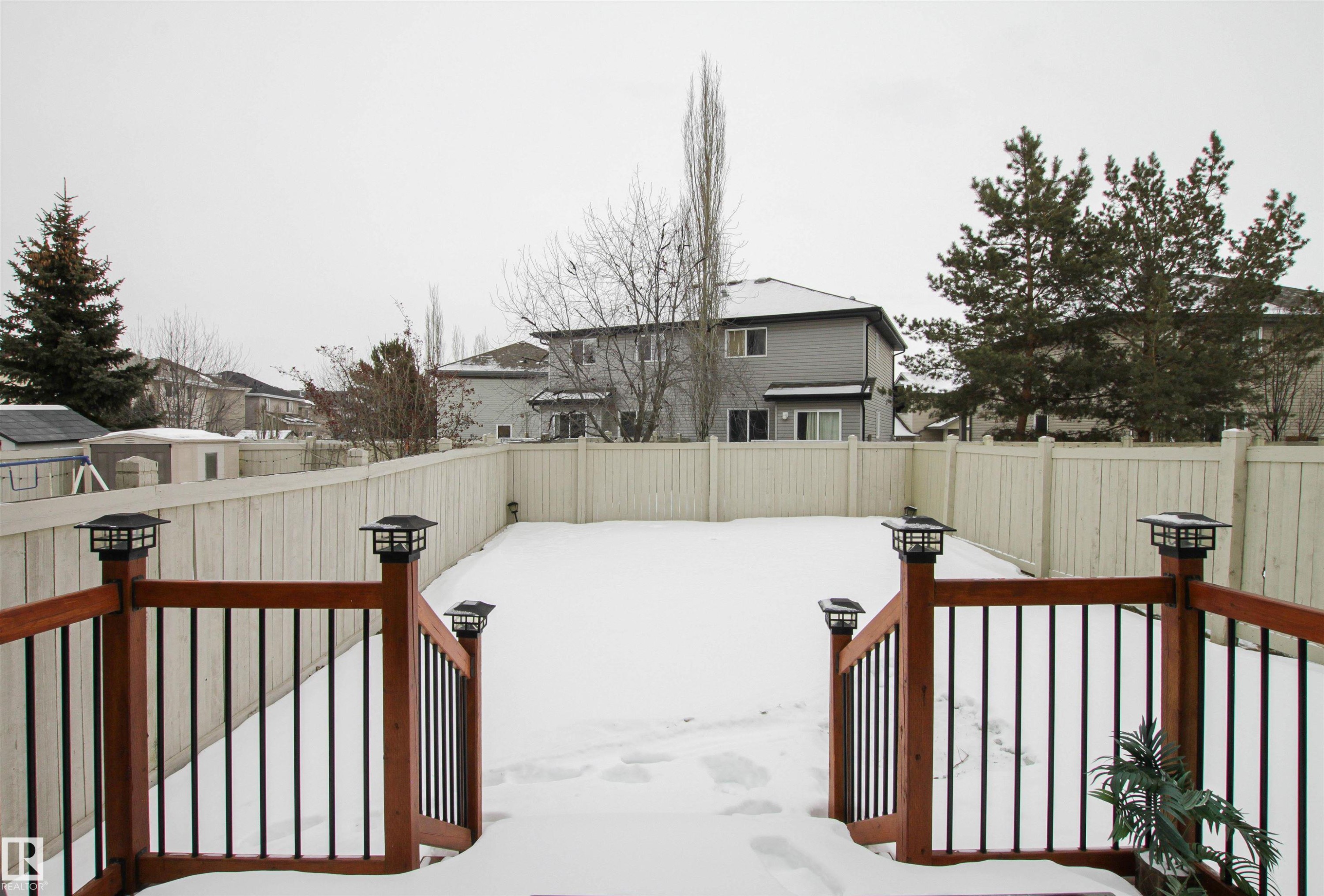 Fenced backyard with a wooden deck and a storage shed - 2315 Lemieux Place, Edmonton, AB - Outdoor With Deck Patio Veranda