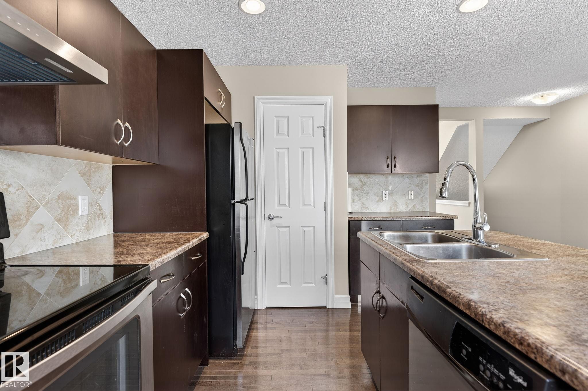 Edmonton, AB - Indoor Photo Showing Kitchen With Stainless Steel Kitchen With Double Sink