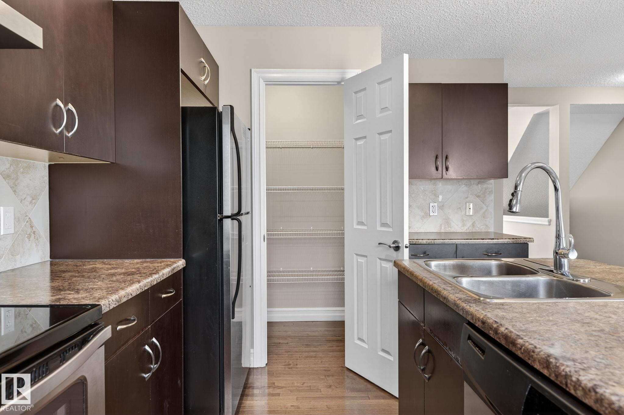 Edmonton, AB - Indoor Photo Showing Kitchen With Double Sink