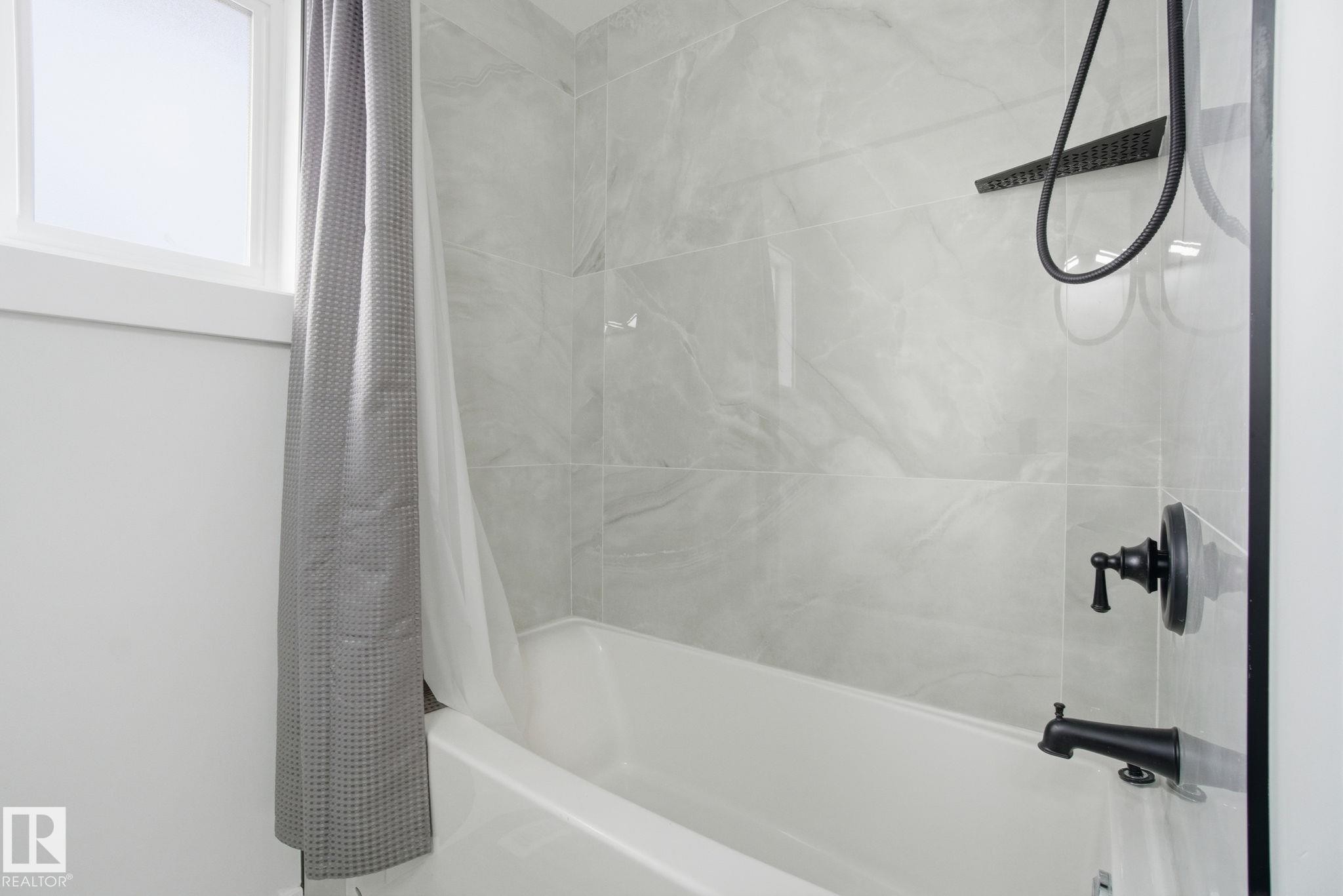 Bathroom with shower / bathtub combination with curtain - 7112 132 Avenue, Edmonton, AB - Indoor Photo Showing Bathroom