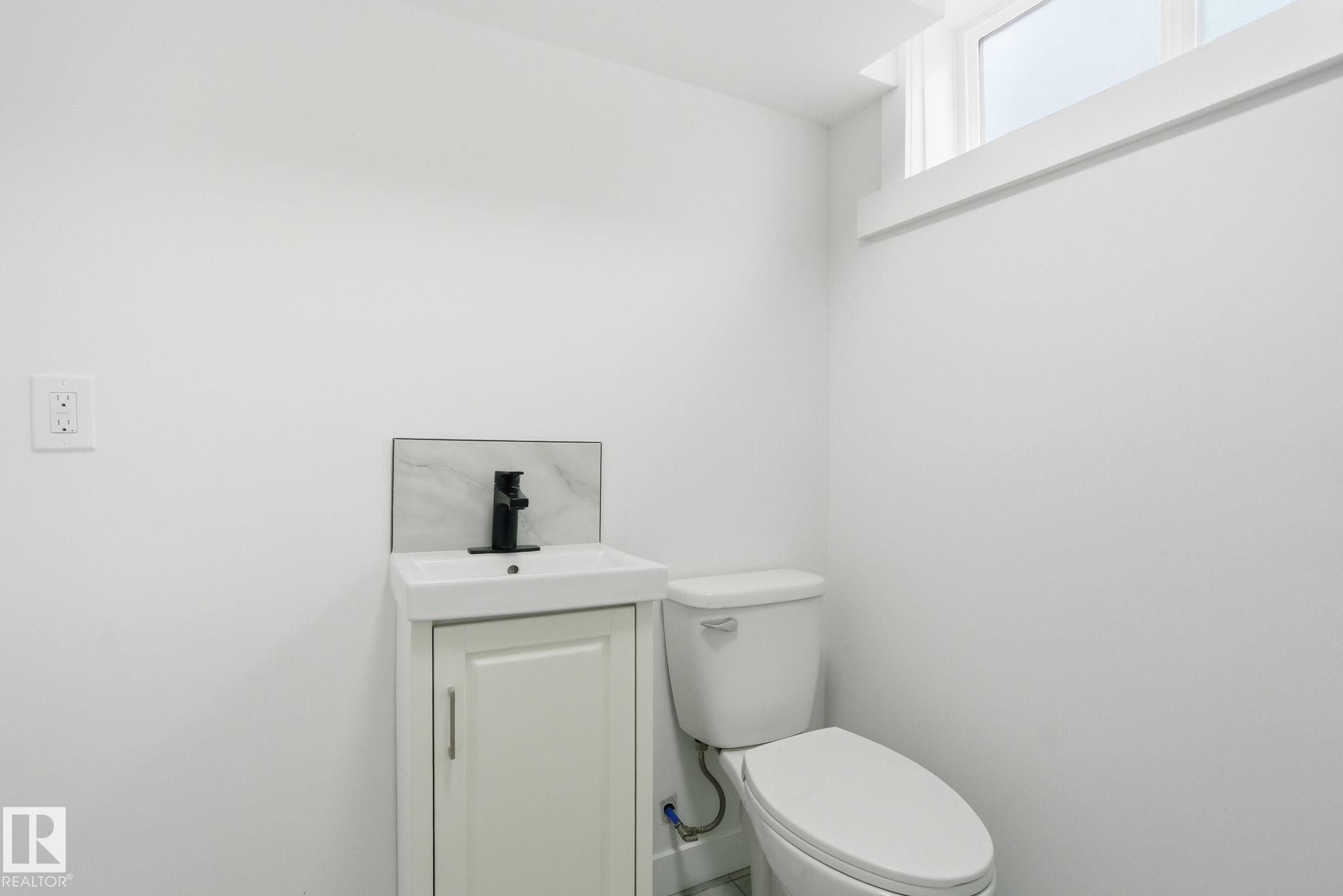 Half bath with vanity and toilet - 7112 132 Avenue, Edmonton, AB - Indoor Photo Showing Bathroom