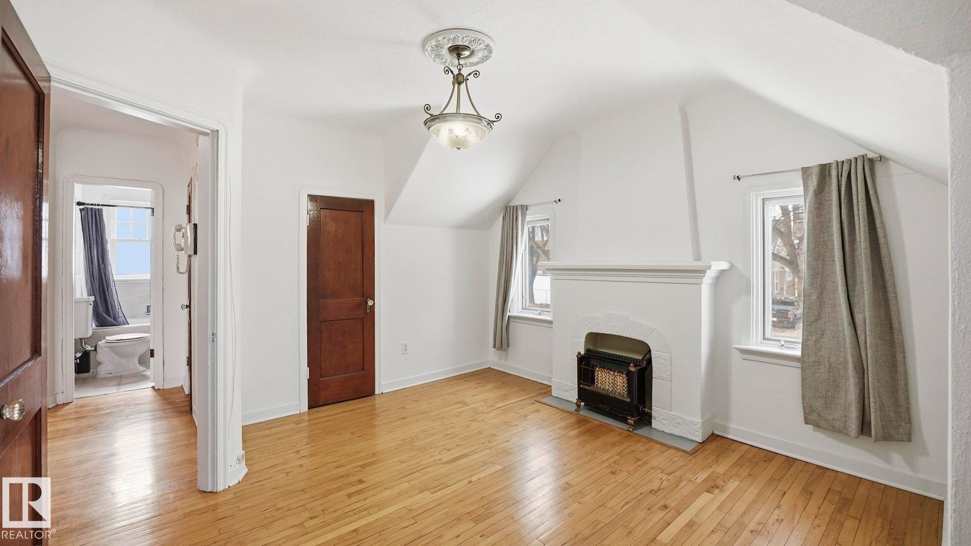 10149 122 Street, Edmonton, AB - Indoor Photo Showing Other Room With Fireplace