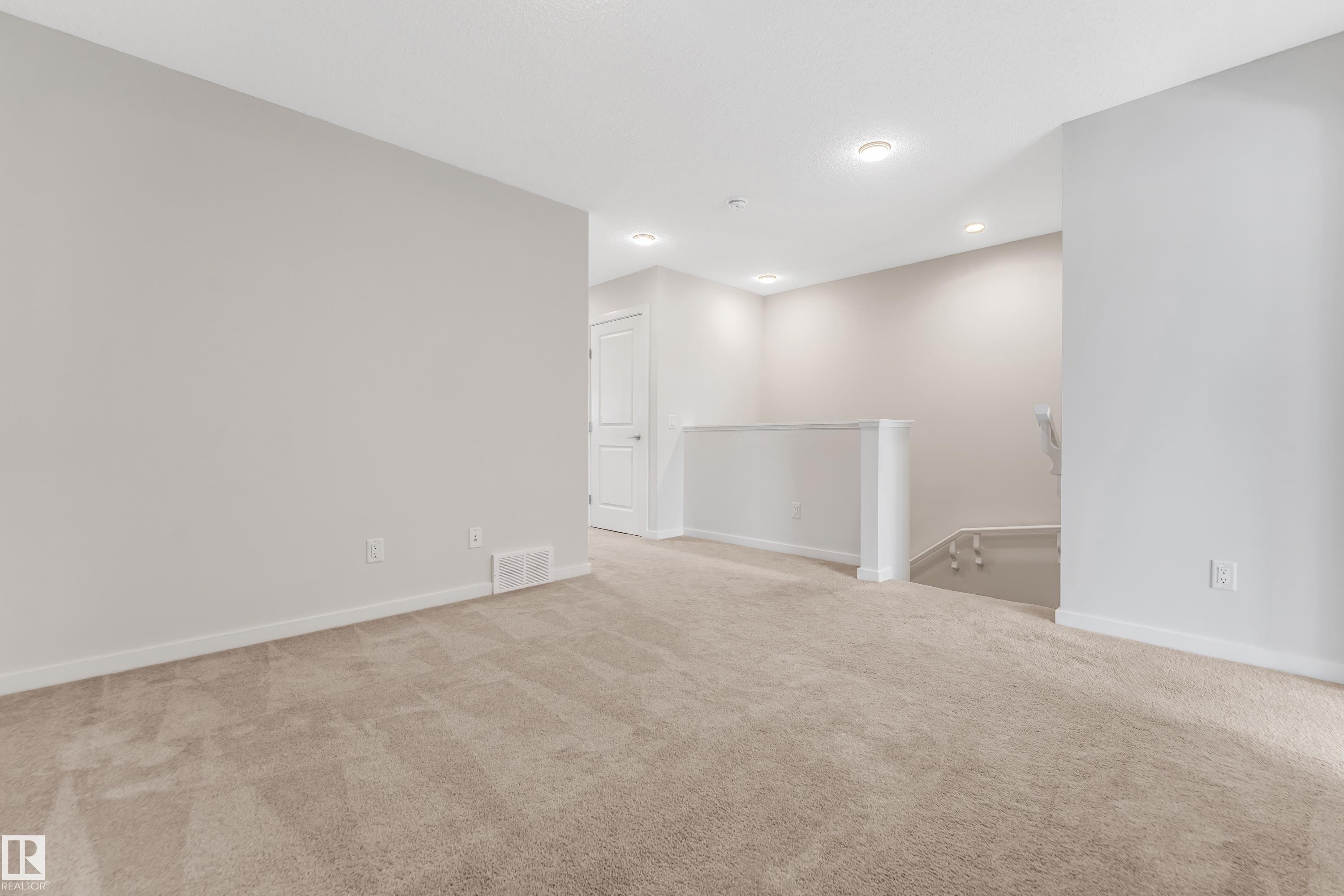 Unfurnished room featuring light carpet and recessed lighting - 2095 Maple Road, Edmonton, AB - Indoor Photo Showing Other Room