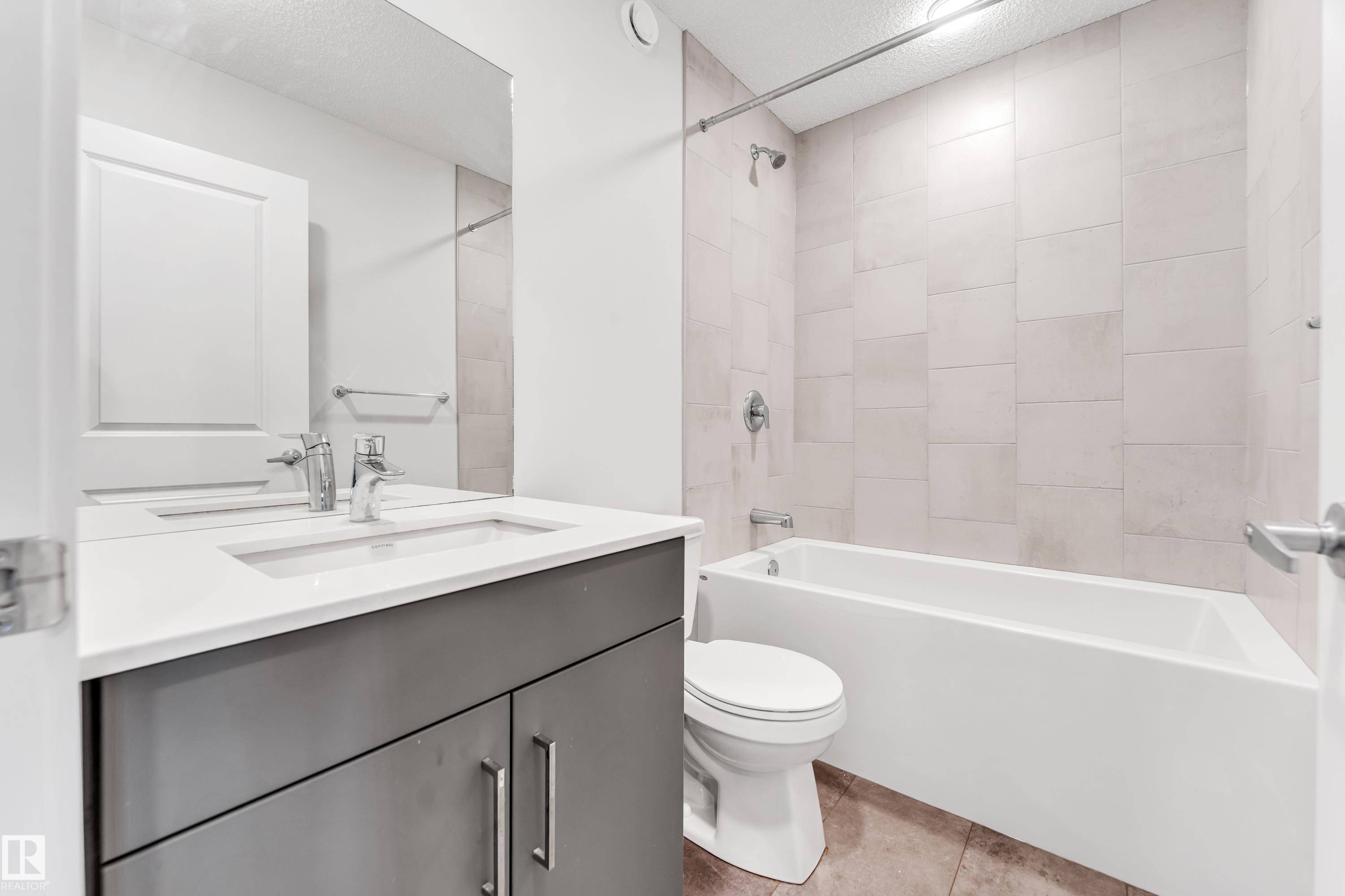 Full bathroom featuring vanity and bathtub / shower combination - 2095 Maple Road, Edmonton, AB - Indoor Photo Showing Bathroom
