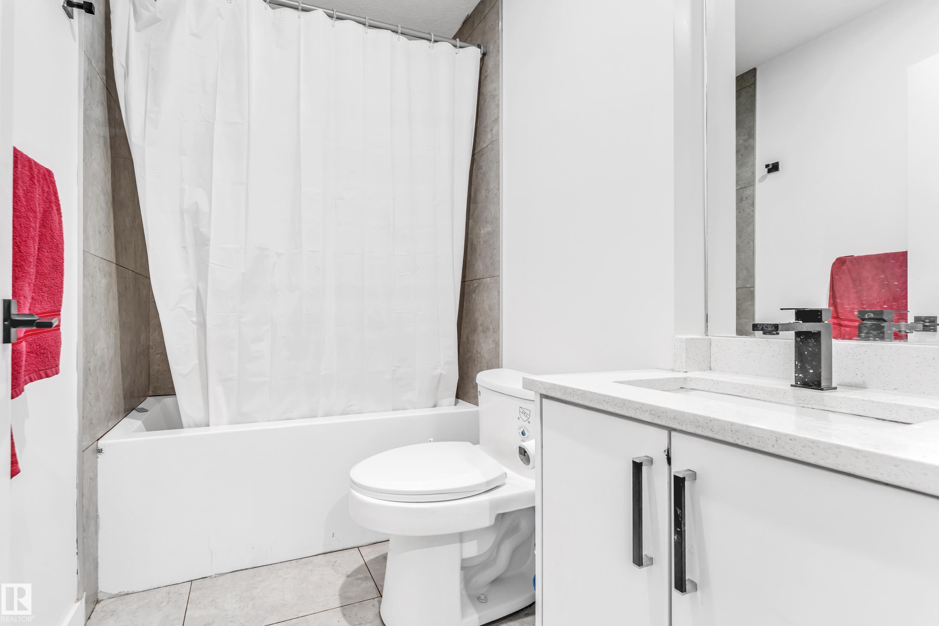 Bathroom featuring shower / bath combination with curtain, vanity, and light tile patterned floors - 2095 Maple Road, Edmonton, AB - Indoor Photo Showing Bathroom