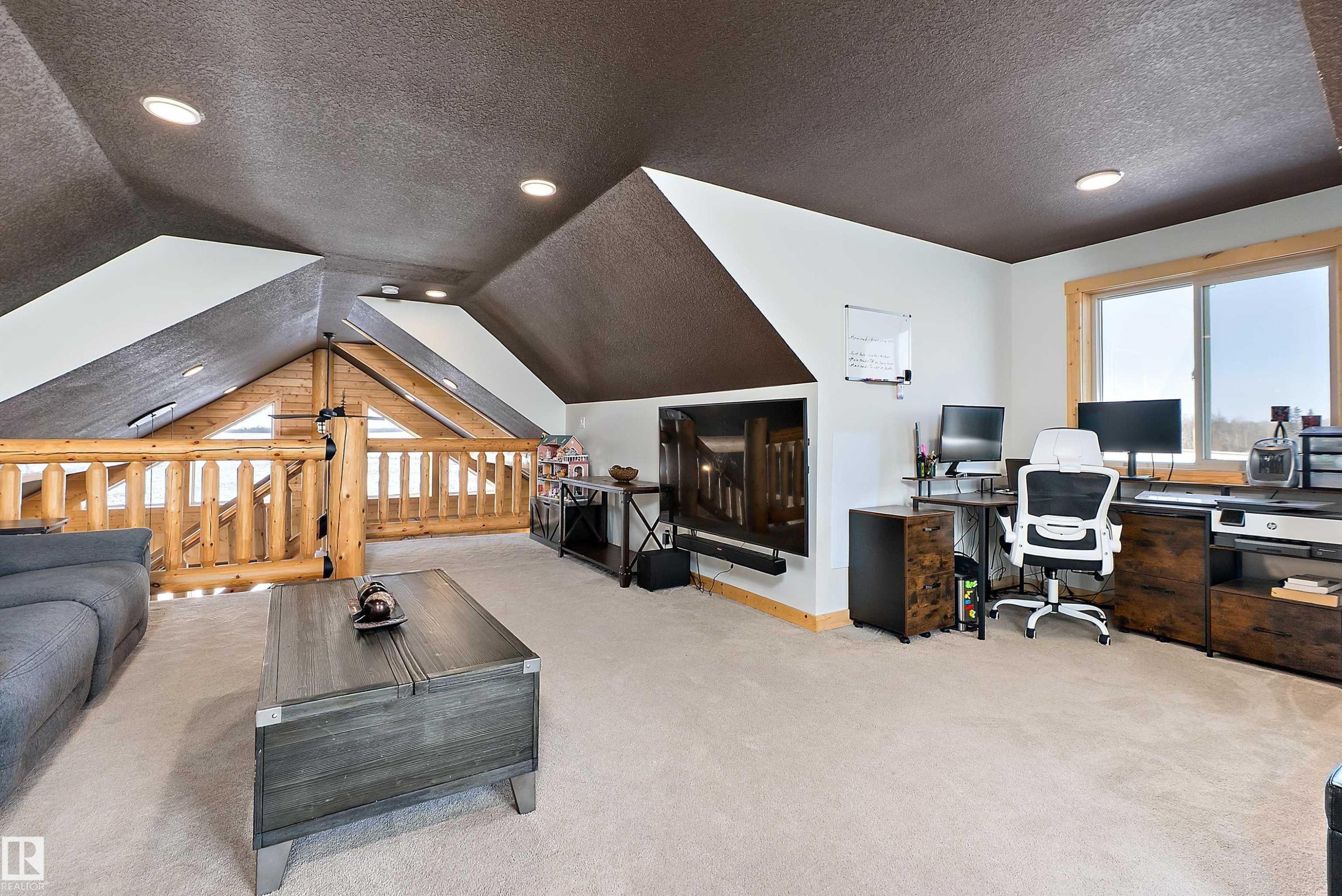 Office area with a textured ceiling, light carpet, vaulted ceiling, and recessed lighting - 19003 Twp Rd 522, Rural Beaver County, AB - Indoor Photo Showing Office