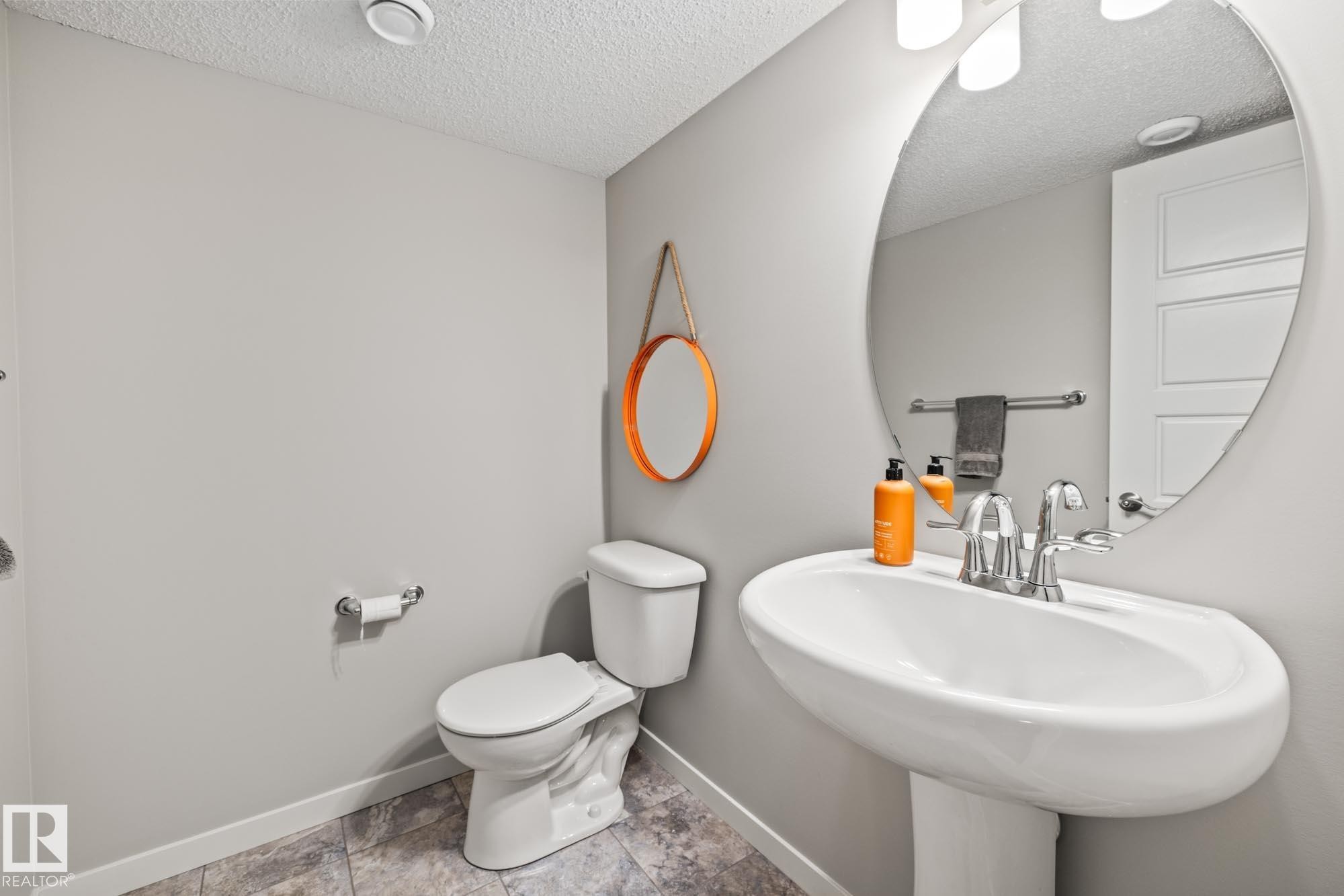 Bathroom featuring a textured ceiling and tile patterned flooring - 20110 27 Avenue, Edmonton, AB - Indoor Photo Showing Bathroom