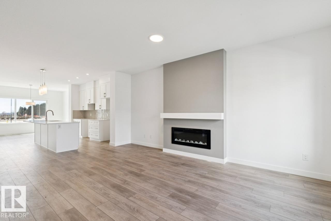 245 Wattle Road, Leduc, AB - Indoor With Fireplace