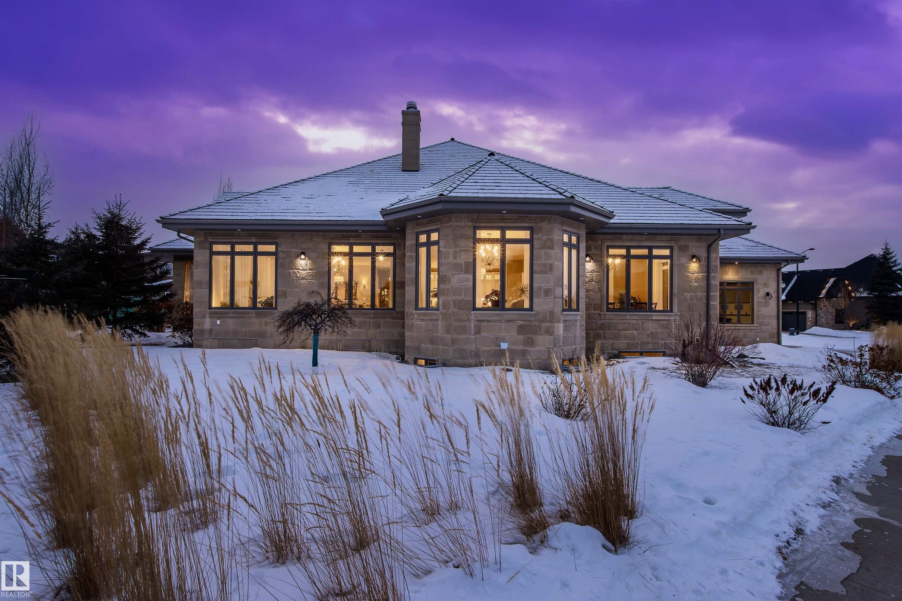 Snow covered rear of property with a chimney and stone siding - 2796 Wheaton Drive, Edmonton, AB - Outdoor