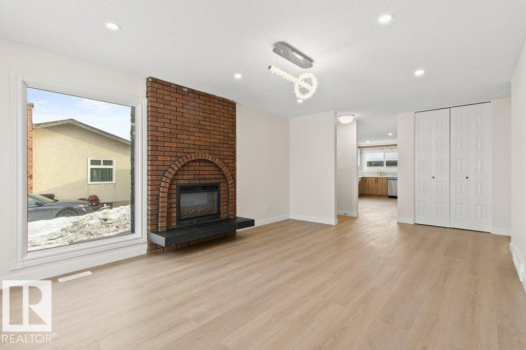 3043 142 Avenue, Edmonton, AB - Indoor Photo Showing Living Room With Fireplace