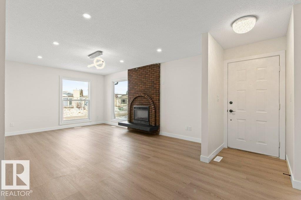 3043 142 Avenue, Edmonton, AB - Indoor Photo Showing Living Room With Fireplace