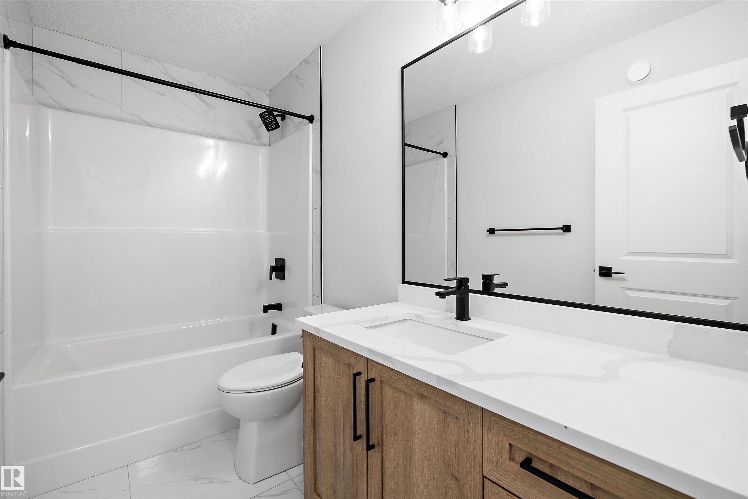 Bathroom with vanity, light marble finish flooring, and shower combination - 230 Edgemont Green Green Nw, Edmonton, AB - Indoor Photo Showing Bathroom