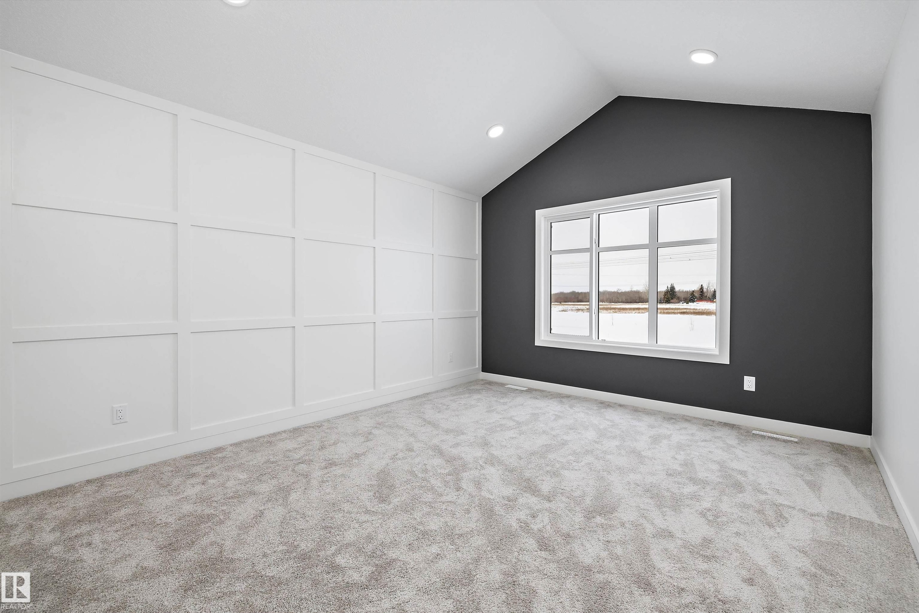 Empty room featuring light carpet, recessed lighting, and a decorative wall - 230 Edgemont Green Green Nw, Edmonton, AB - Indoor Photo Showing Other Room