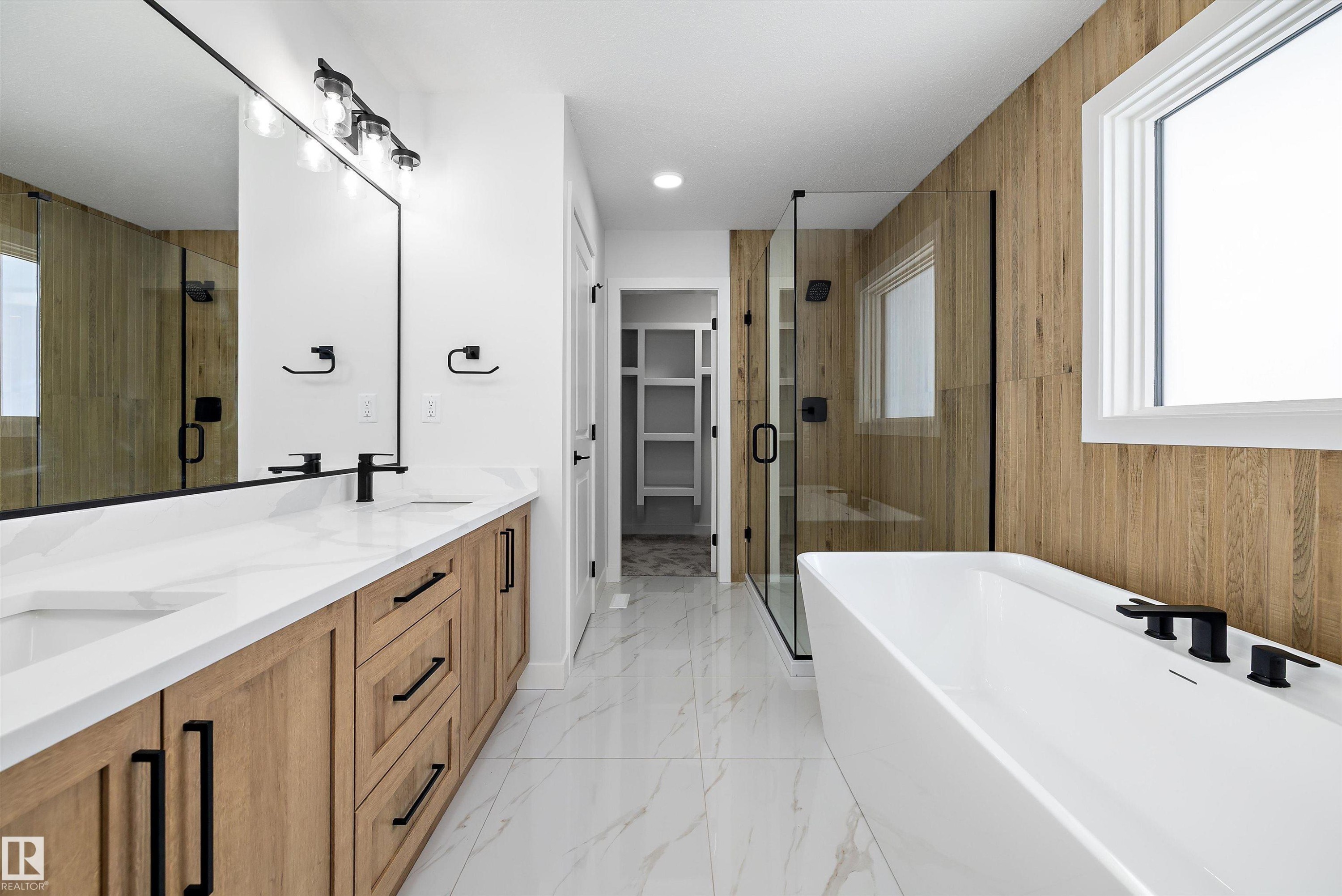 Bathroom featuring a shower stall, a spacious closet, double vanity, a freestanding bath, and recessed lighting - 230 Edgemont Green Green Nw, Edmonton, AB - Indoor Photo Showing Bathroom