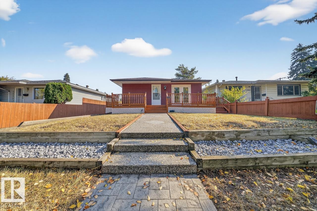 Ranch-style home featuring a wooden deck - 12919 113A Street, Edmonton, AB - Outdoor