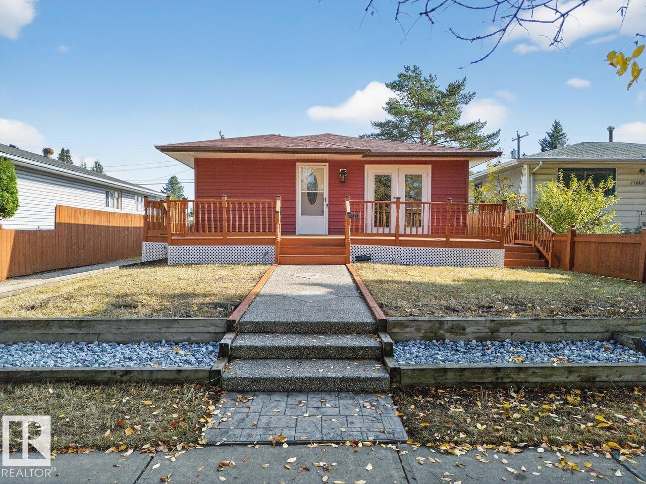 View of front of property featuring a deck - 12919 113A Street, Edmonton, AB - Outdoor With Deck Patio Veranda