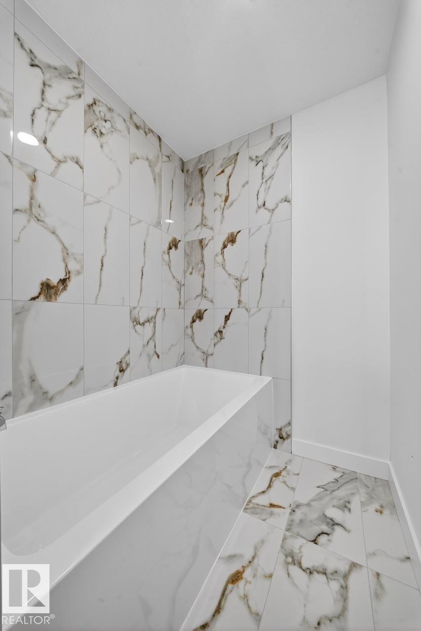 Bathroom with marble finish floors and baseboards - 12919 113A Street, Edmonton, AB - Indoor Photo Showing Bathroom