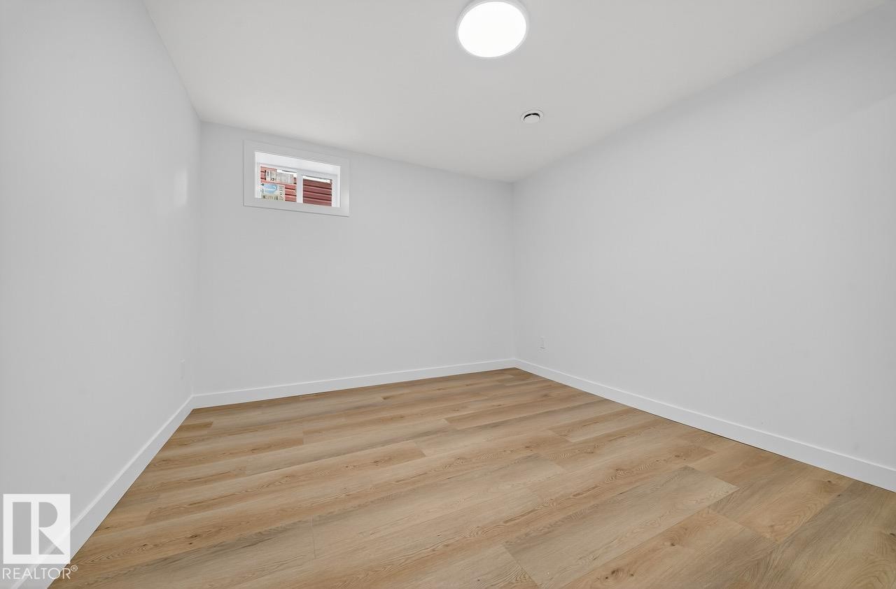 Spare room featuring light wood finished floors - 12919 113A Street, Edmonton, AB - Indoor Photo Showing Other Room