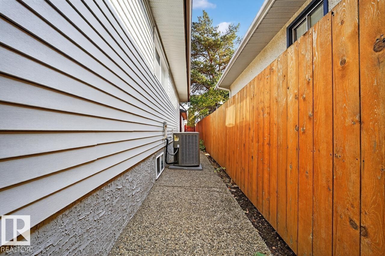 View of home's exterior with a central AC unit - 12919 113A Street, Edmonton, AB - With Exterior