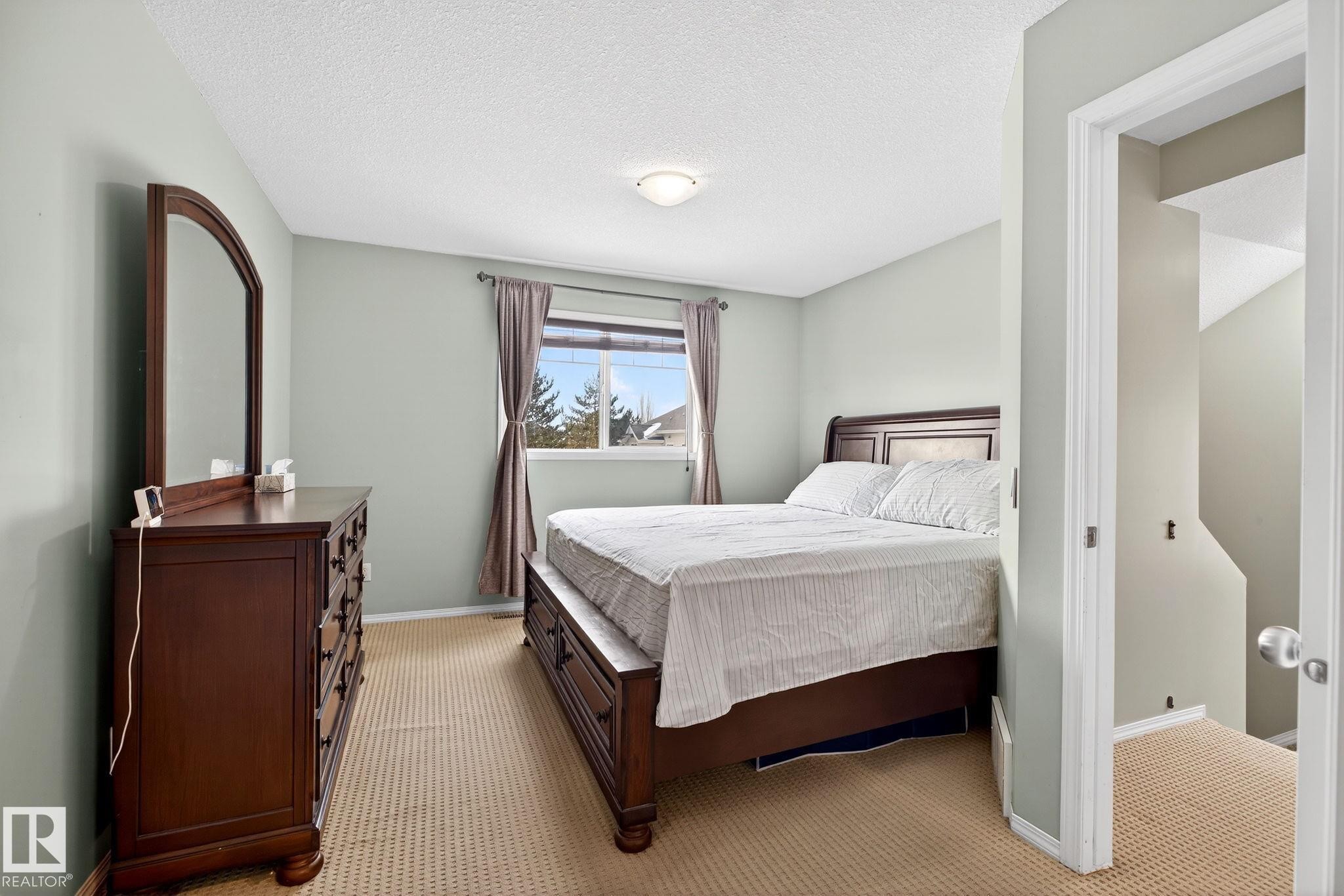 108 150 Edwards Drive, Edmonton, AB - Indoor Photo Showing Bedroom