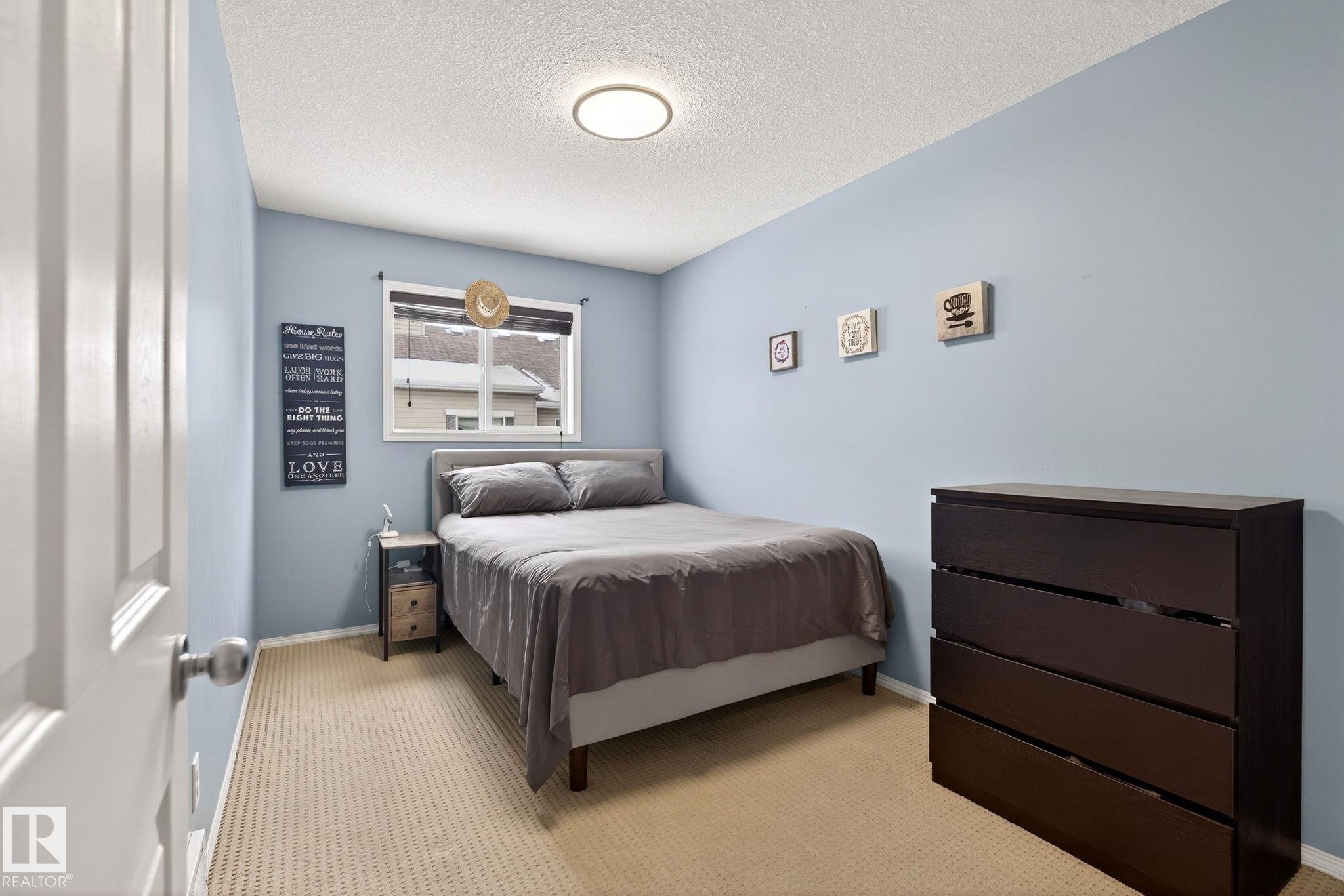 108 150 Edwards Drive, Edmonton, AB - Indoor Photo Showing Bedroom