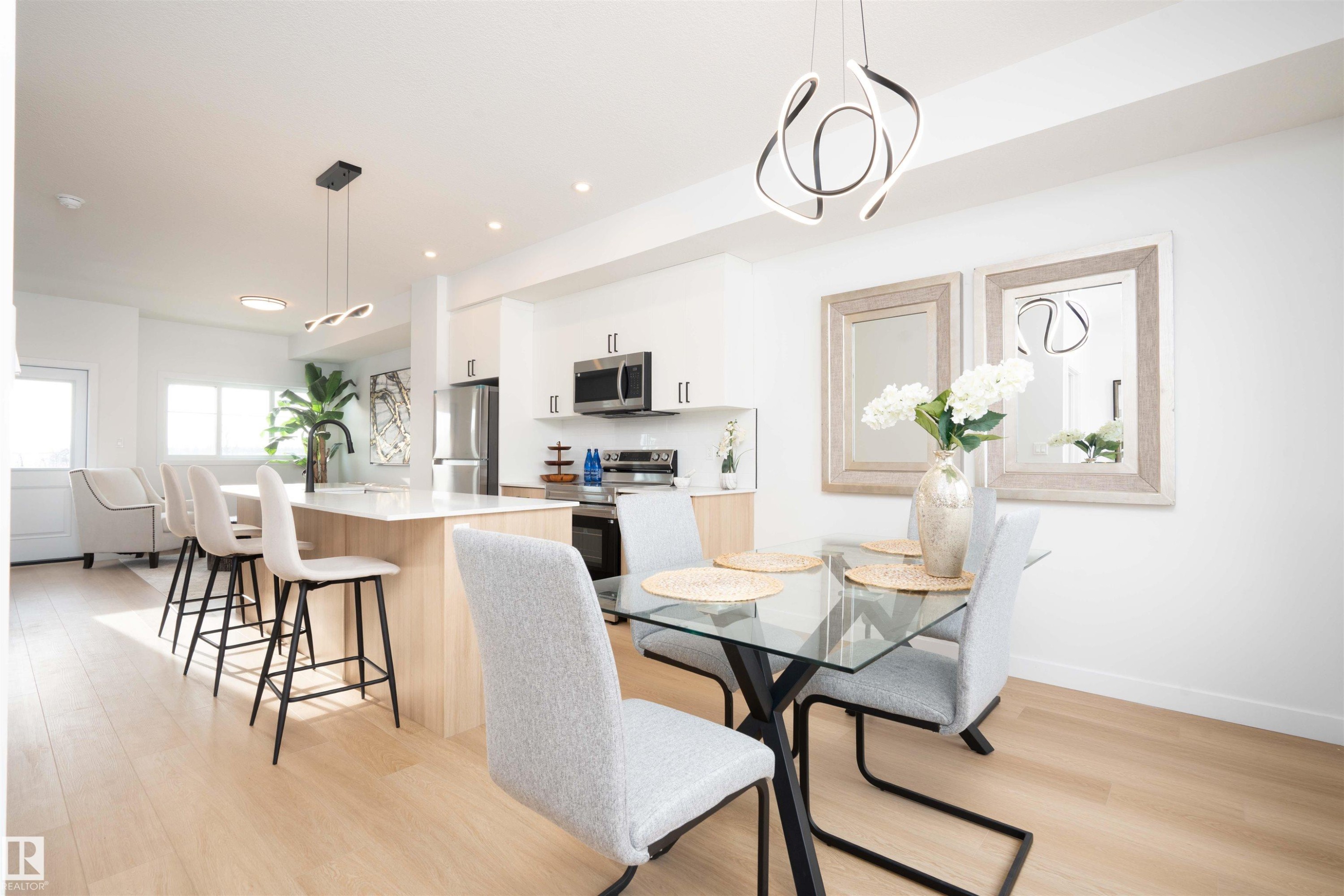 Dining space with light wood-style flooring and recessed lighting - 64 18120 28 Avenue Sw, Edmonton, AB - Indoor Photo Showing Dining Room