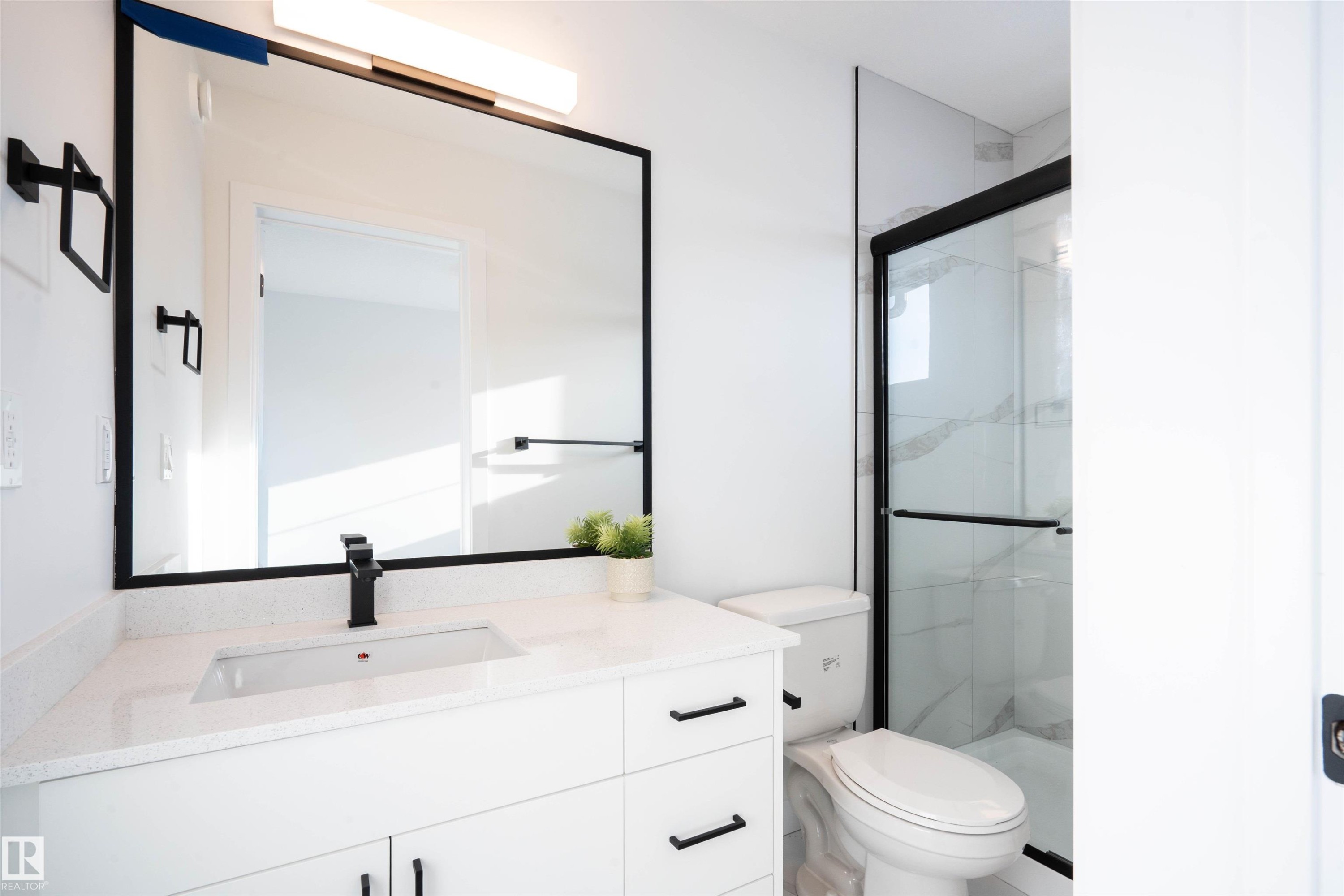 Bathroom featuring a stall shower and vanity - 64 18120 28 Avenue Sw, Edmonton, AB - Indoor Photo Showing Bathroom