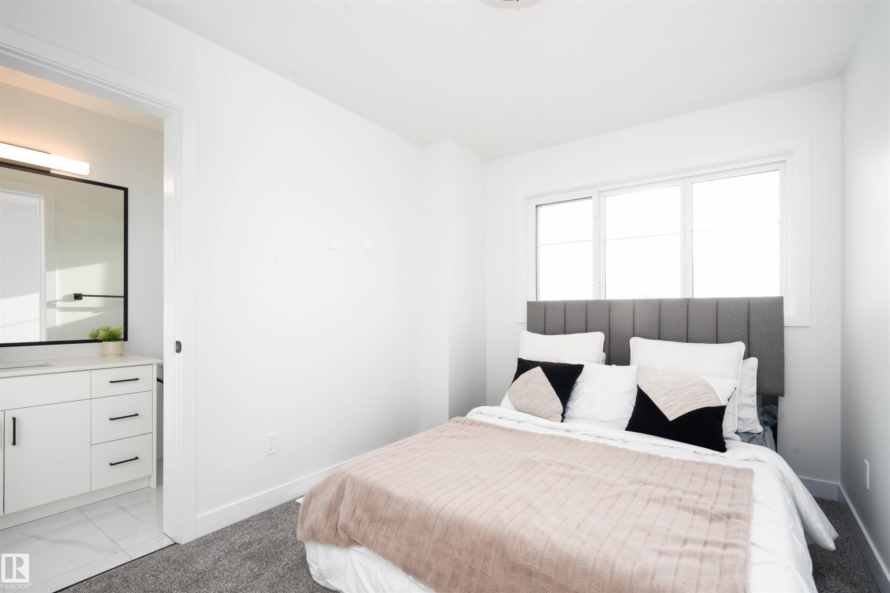 Bedroom featuring baseboards and light colored carpet - 64 18120 28 Avenue Sw, Edmonton, AB - Indoor Photo Showing Bedroom