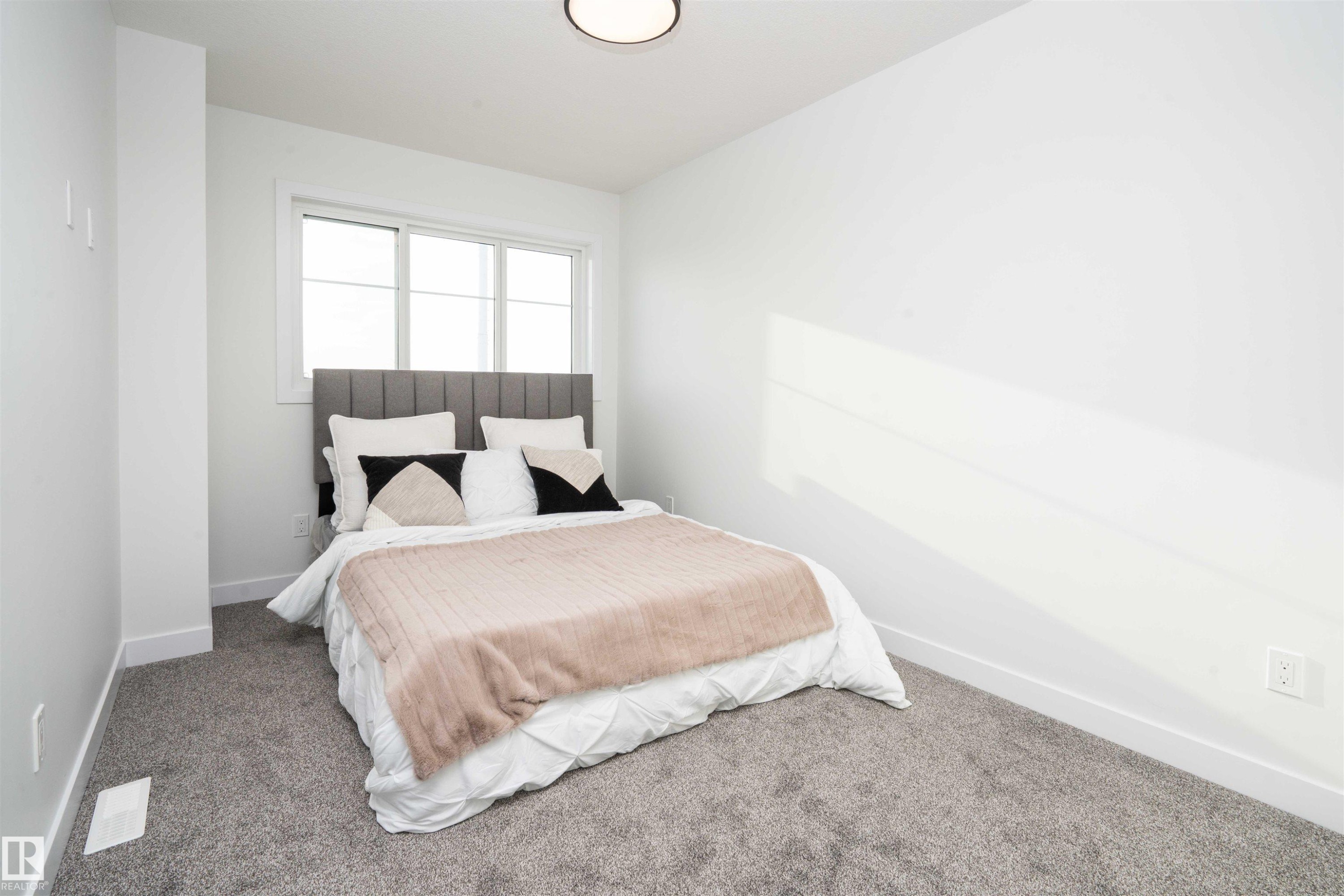 Bedroom featuring carpet - 64 18120 28 Avenue Sw, Edmonton, AB - Indoor Photo Showing Bedroom