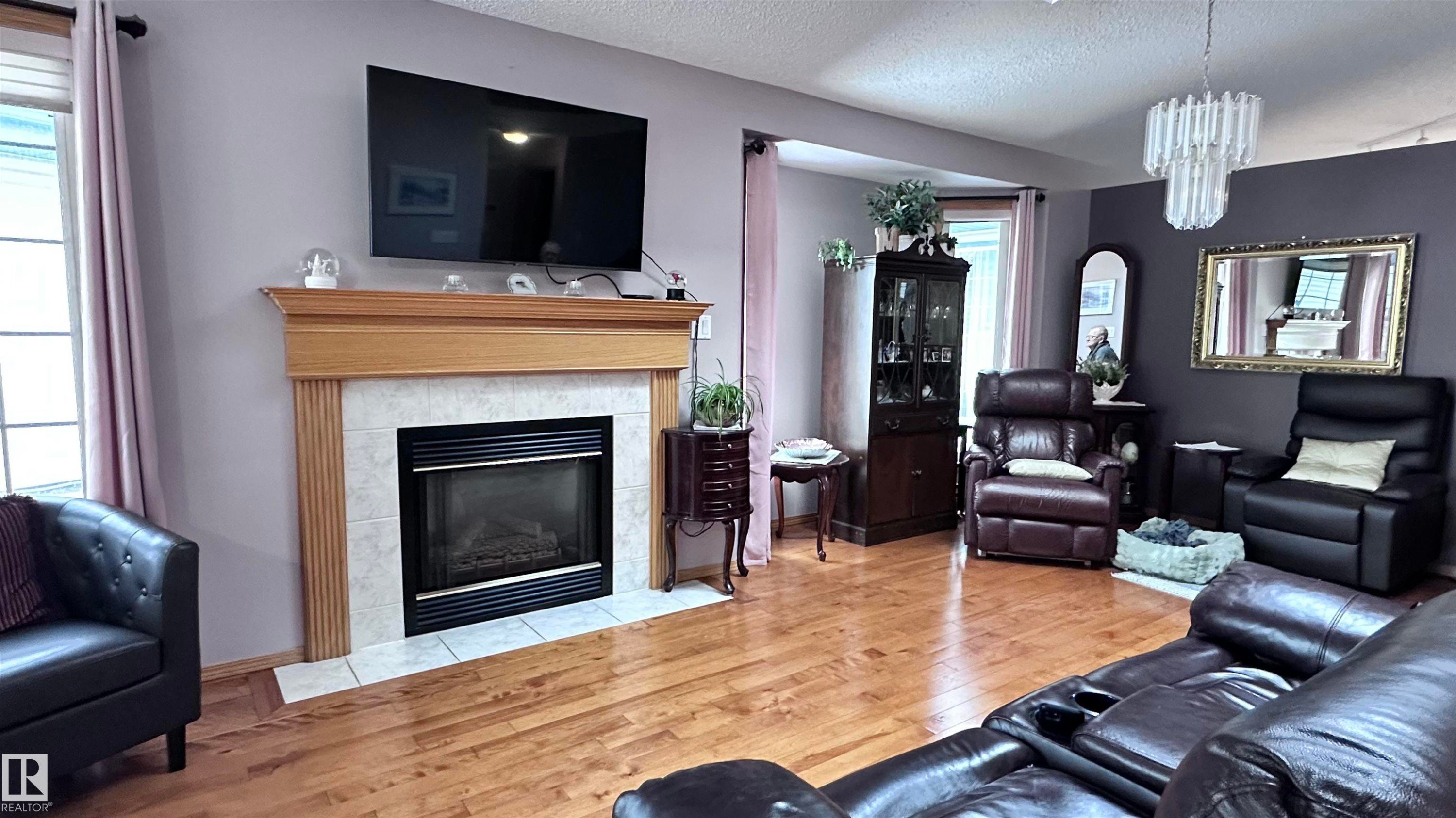 8 9731 174 Street, Edmonton, AB - Indoor Photo Showing Living Room With Fireplace