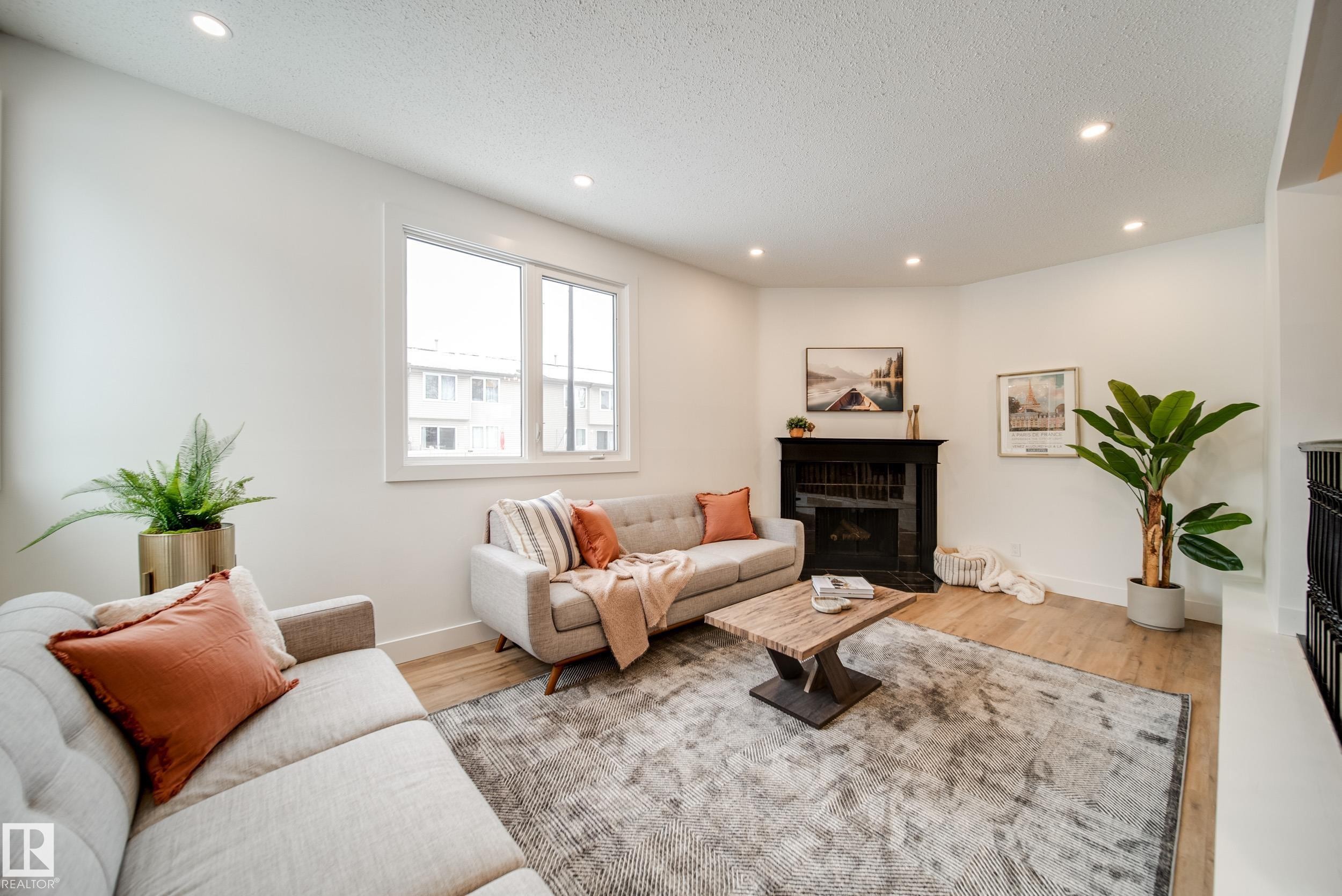 66 Akinsdale Gardens, St. Albert, AB - Indoor Photo Showing Living Room With Fireplace