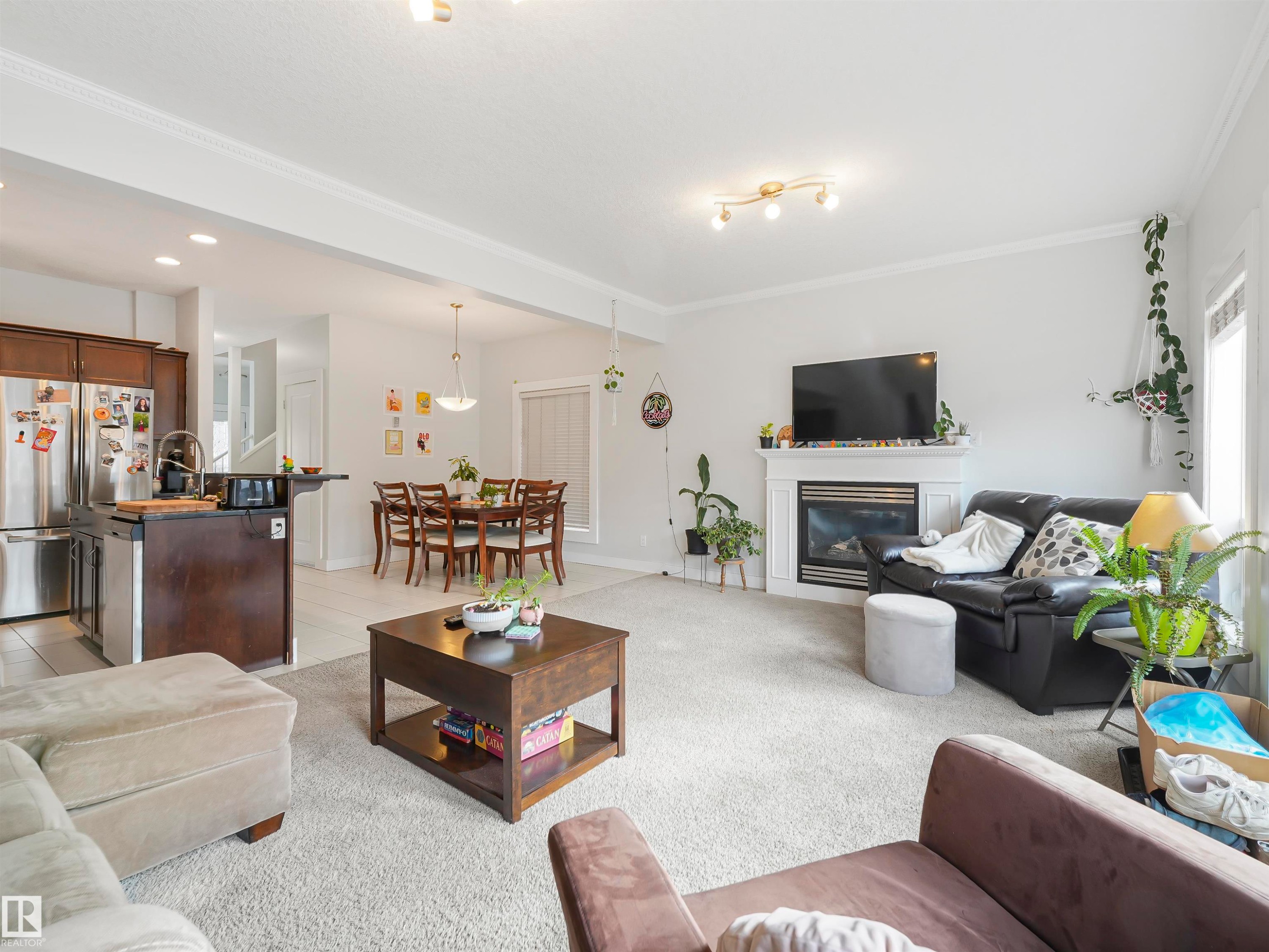 10941/10943 76 Avenue, Edmonton, AB - Indoor Photo Showing Living Room With Fireplace