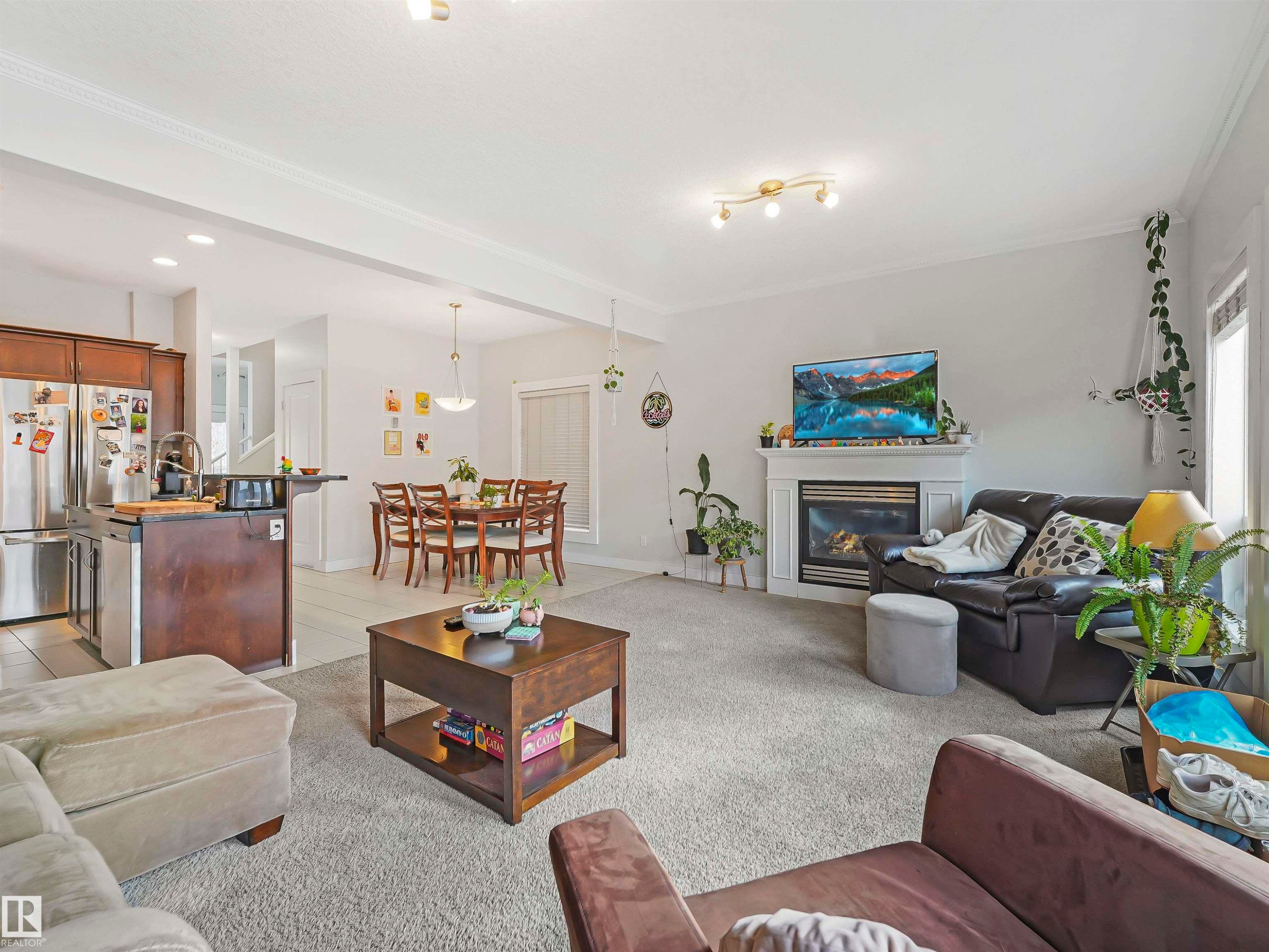 10941/10943 76 Avenue, Edmonton, AB - Indoor Photo Showing Living Room With Fireplace