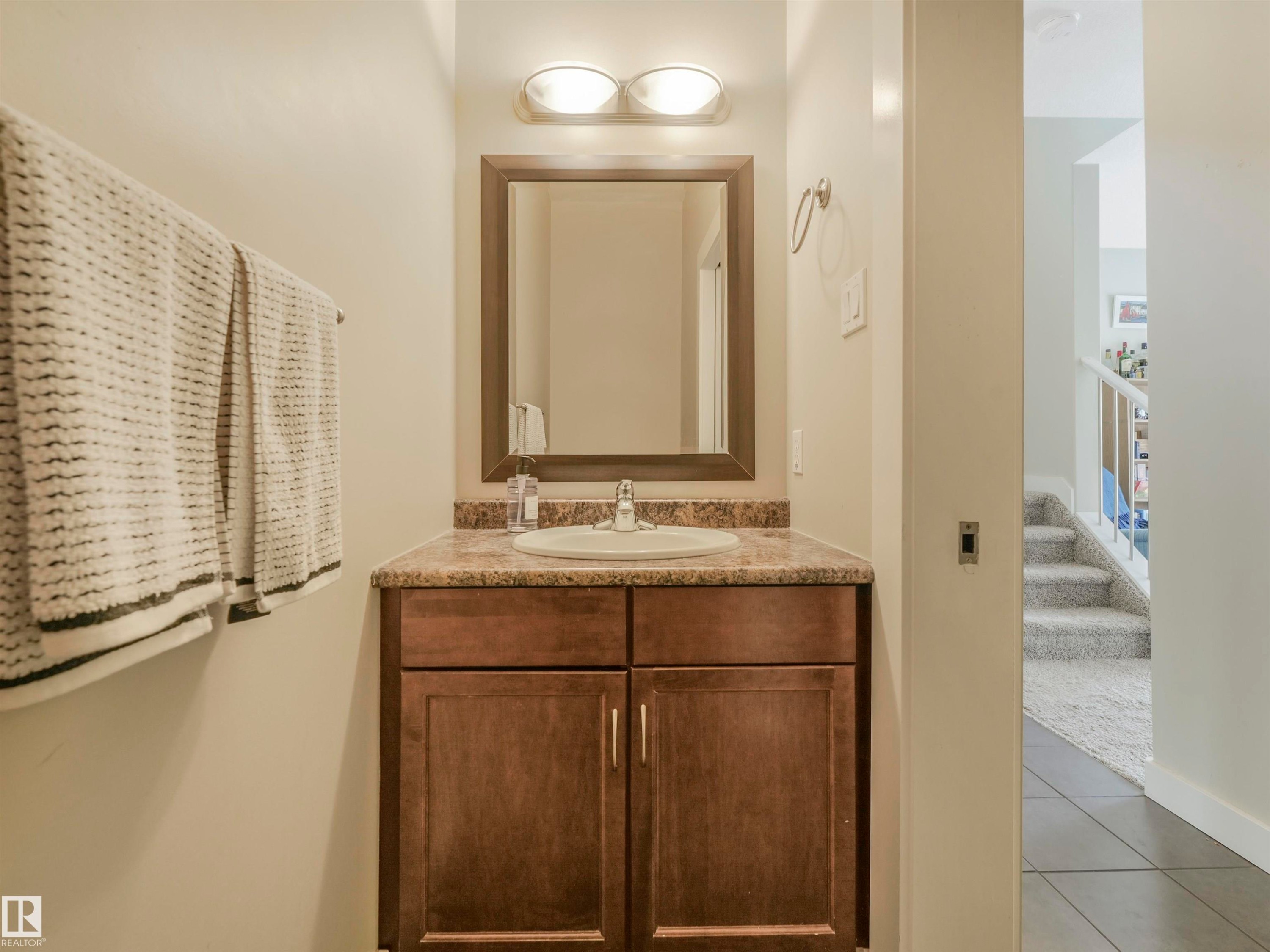 Convenient main floor bathroom, tucked away for added privacy. - 10943 76 Avenue, Edmonton, AB - Indoor Photo Showing Bathroom
