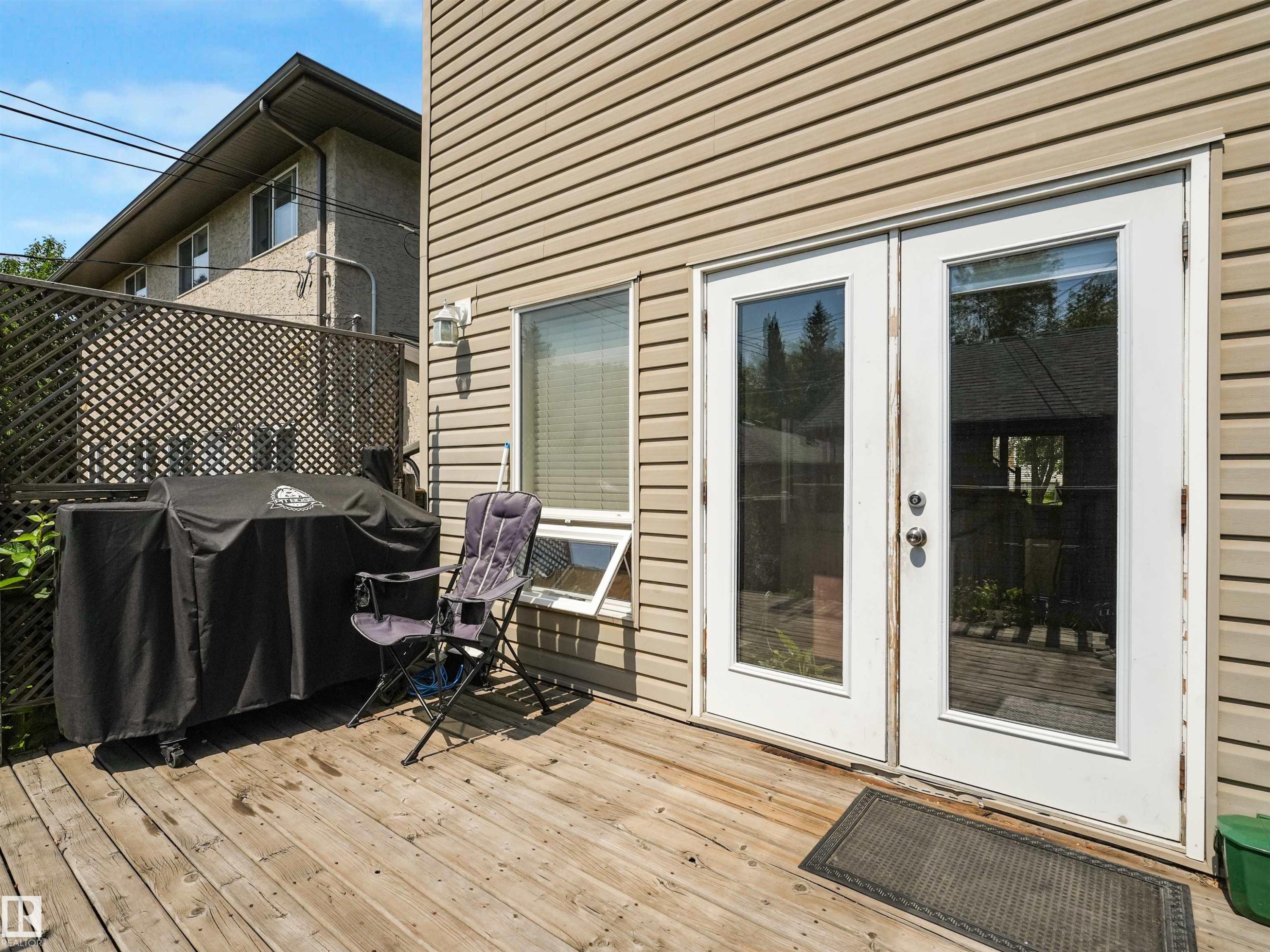Sunny, south-facing decks. - 10943 76 Avenue, Edmonton, AB - Outdoor With Deck Patio Veranda With Exterior
