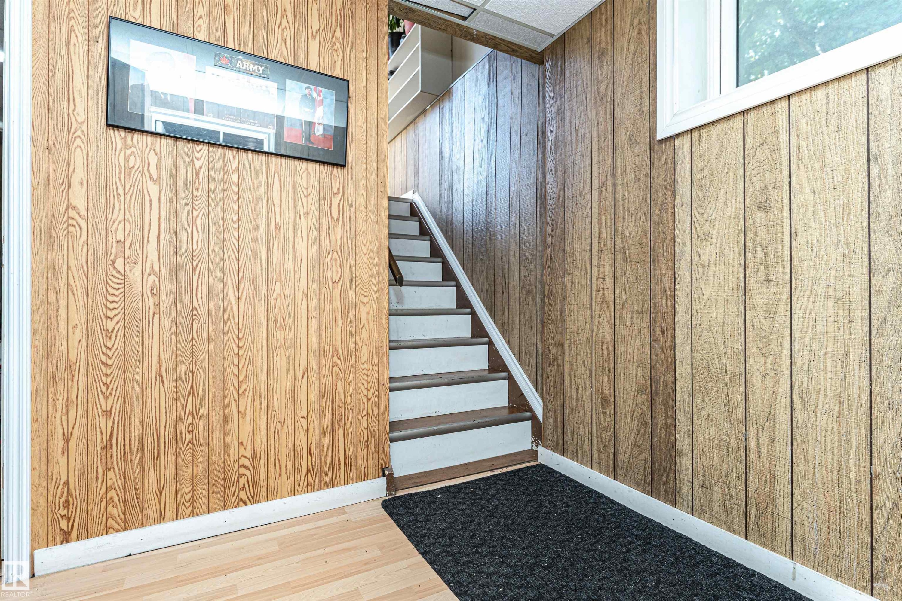 Stairs featuring wood walls and wood finished floors - 2349 Millbourne Road W, Edmonton, AB - Indoor Photo Showing Other Room