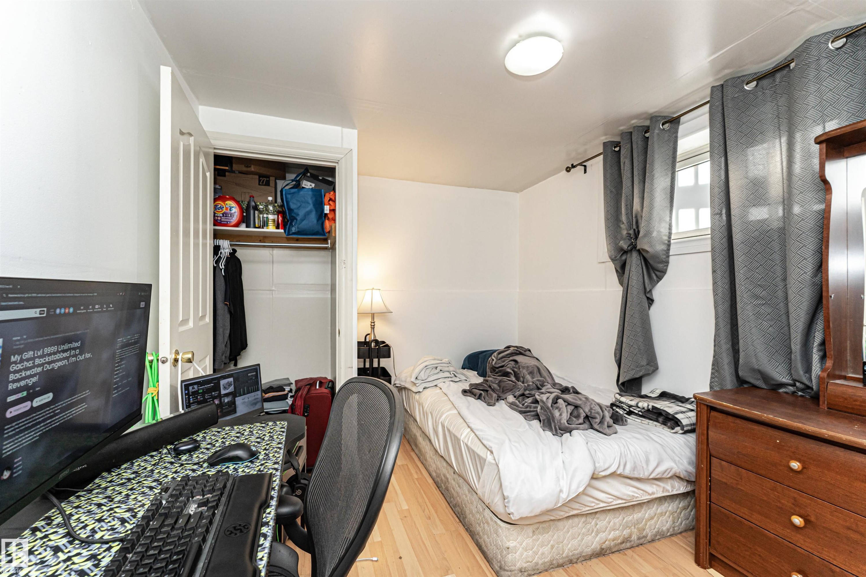 Bedroom featuring light wood-style flooring and a closet - 2349 Millbourne Road W, Edmonton, AB - Indoor
