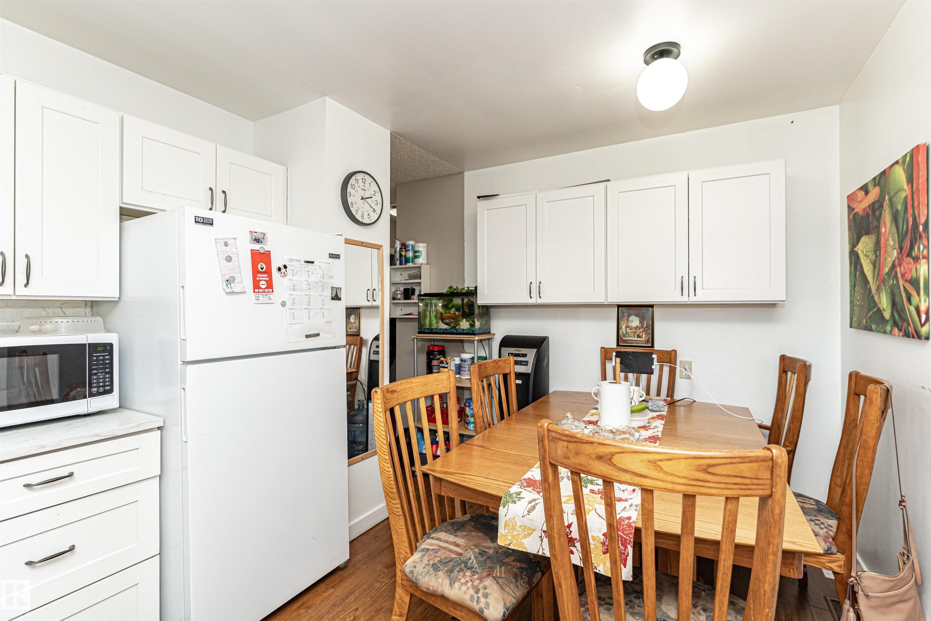 Dining area featuring wood finished floors - 2349 Millbourne Road W, Edmonton, AB - Indoor Photo Showing Dining Room